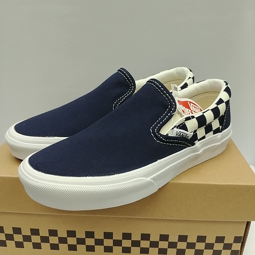 navy checkerboard slip on vans