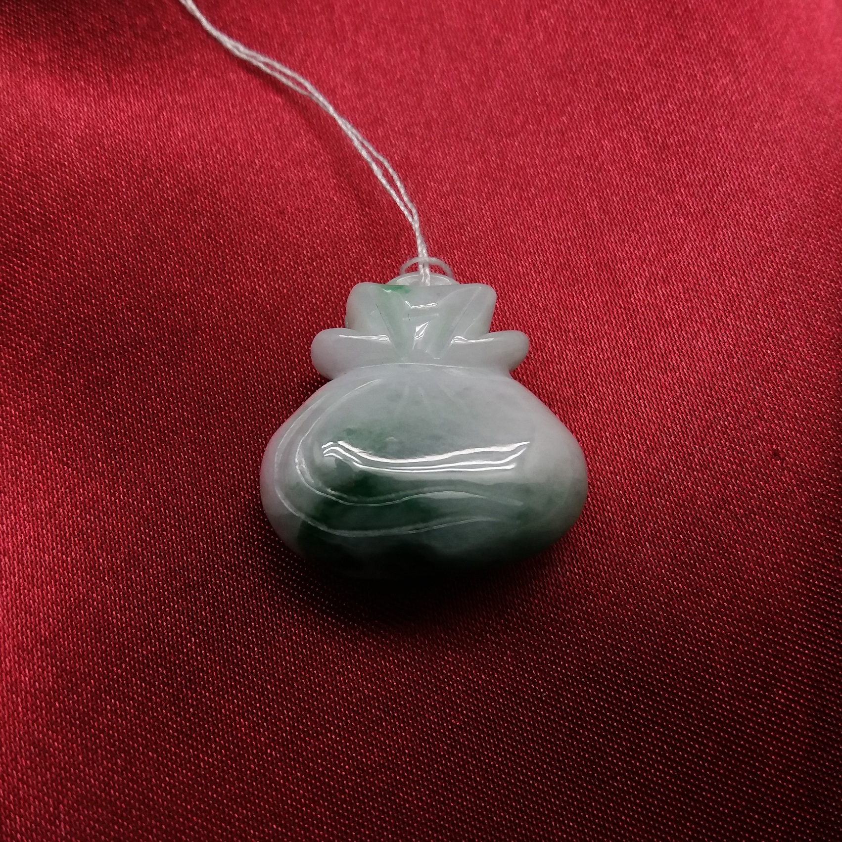 J114 白底飄綠金錢袋