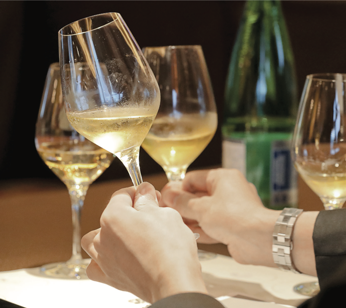 admiring the golden hue of Franciacorta