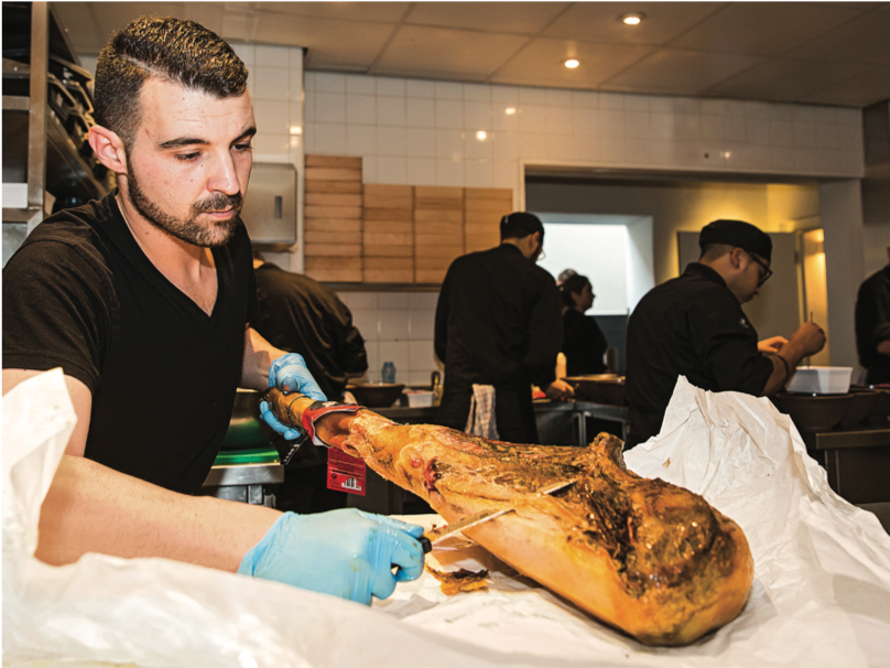 Joselito being trimmed before it is used in the kitchen: the pigs that provide this excellent delicacy live in the wild