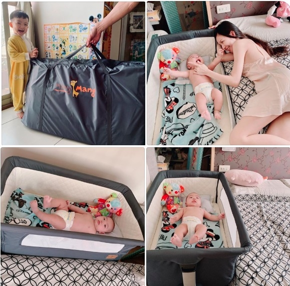 年輕辣媽咪和床邊床的小寶寶