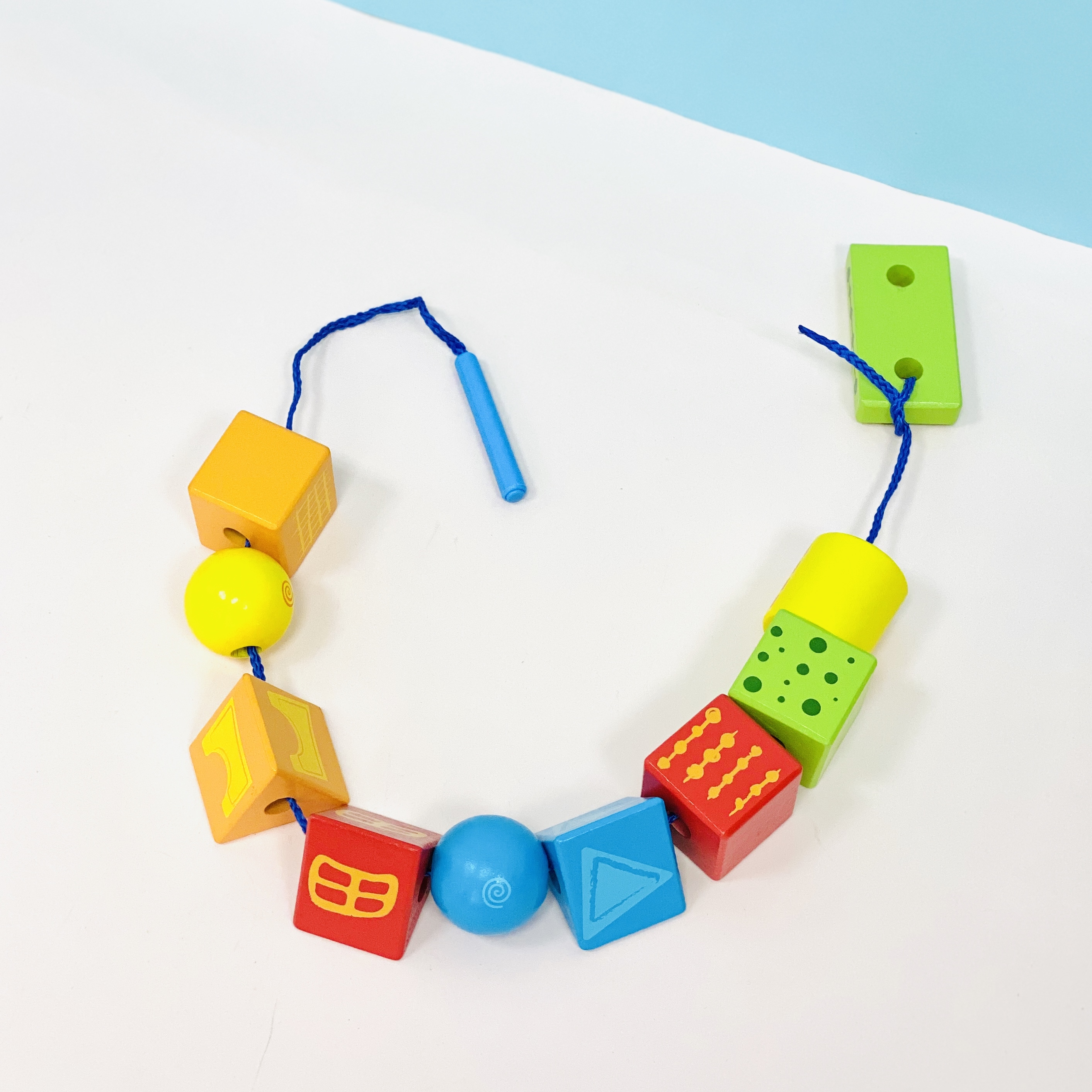 hape string along shapes