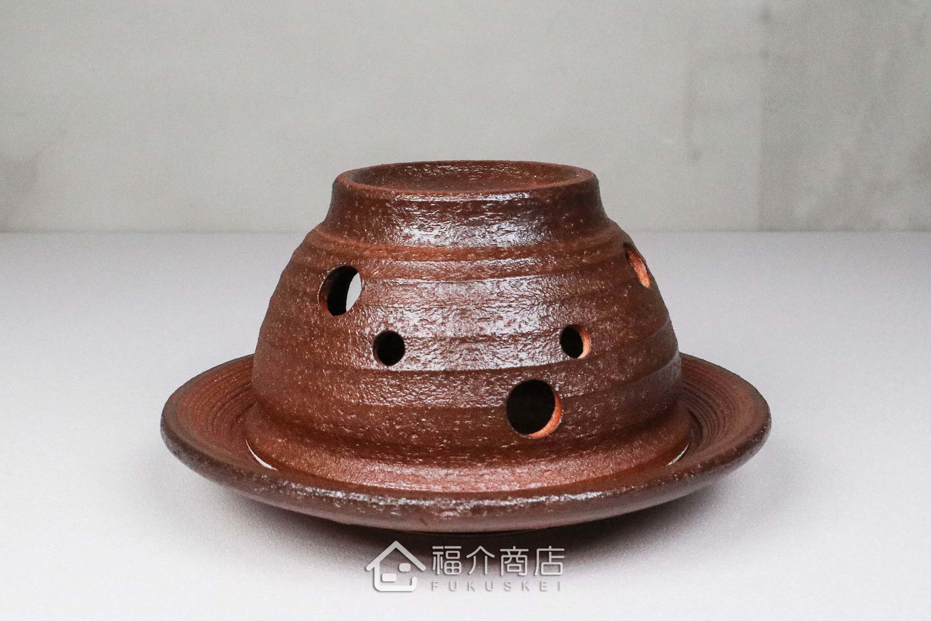 咖啡色的陶瓷茶香爐