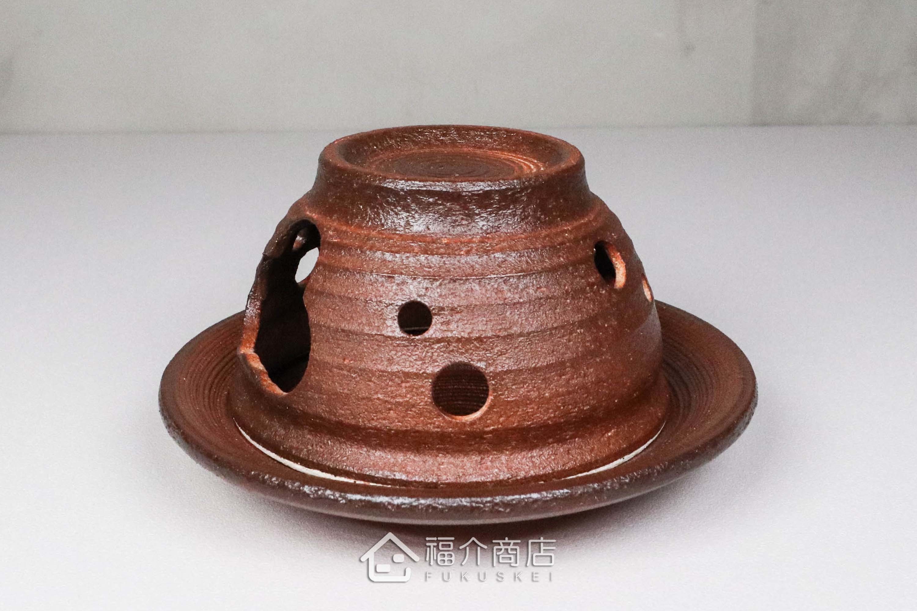 咖啡色的陶瓷茶香爐