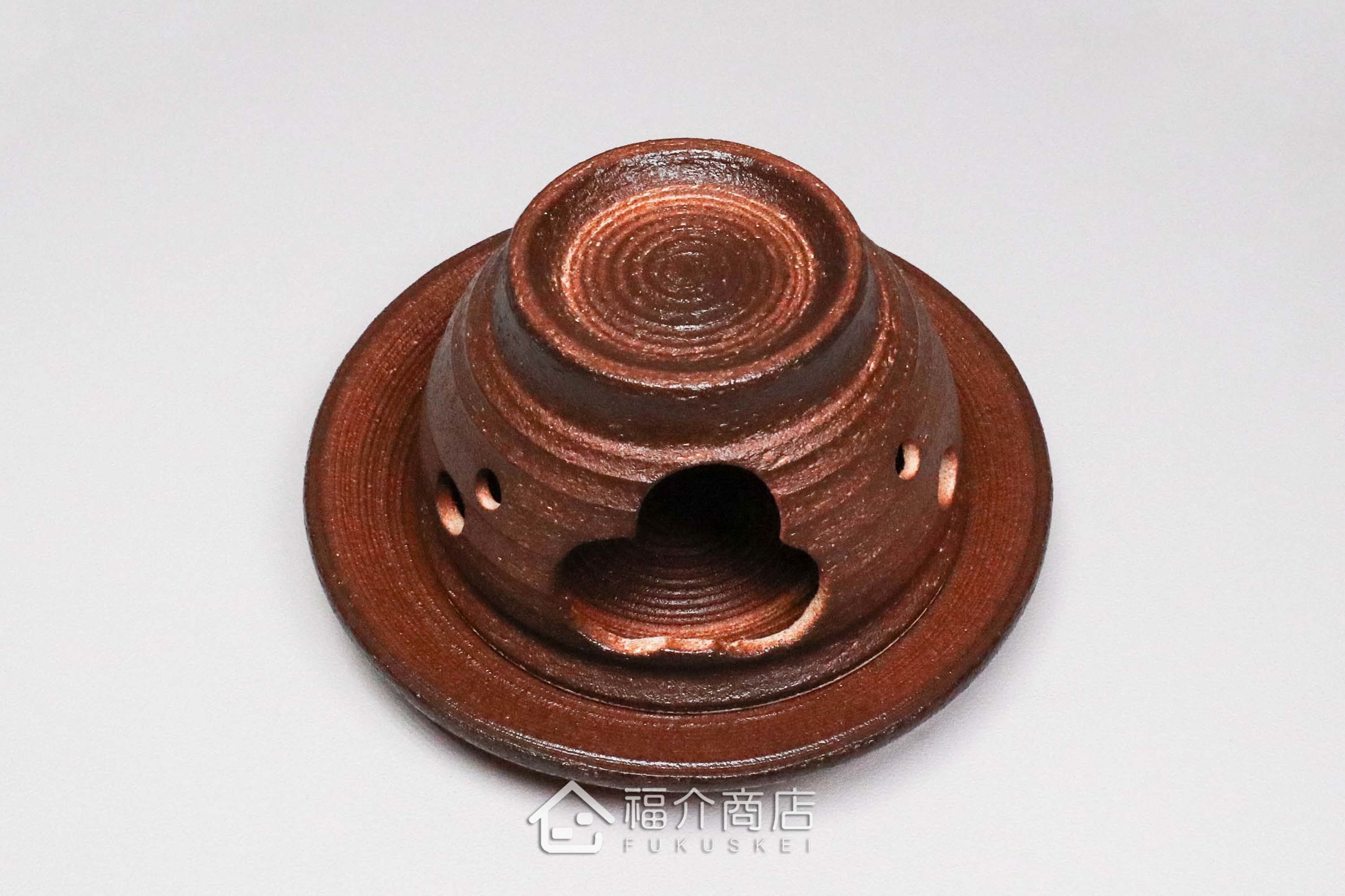 咖啡色的陶瓷茶香爐