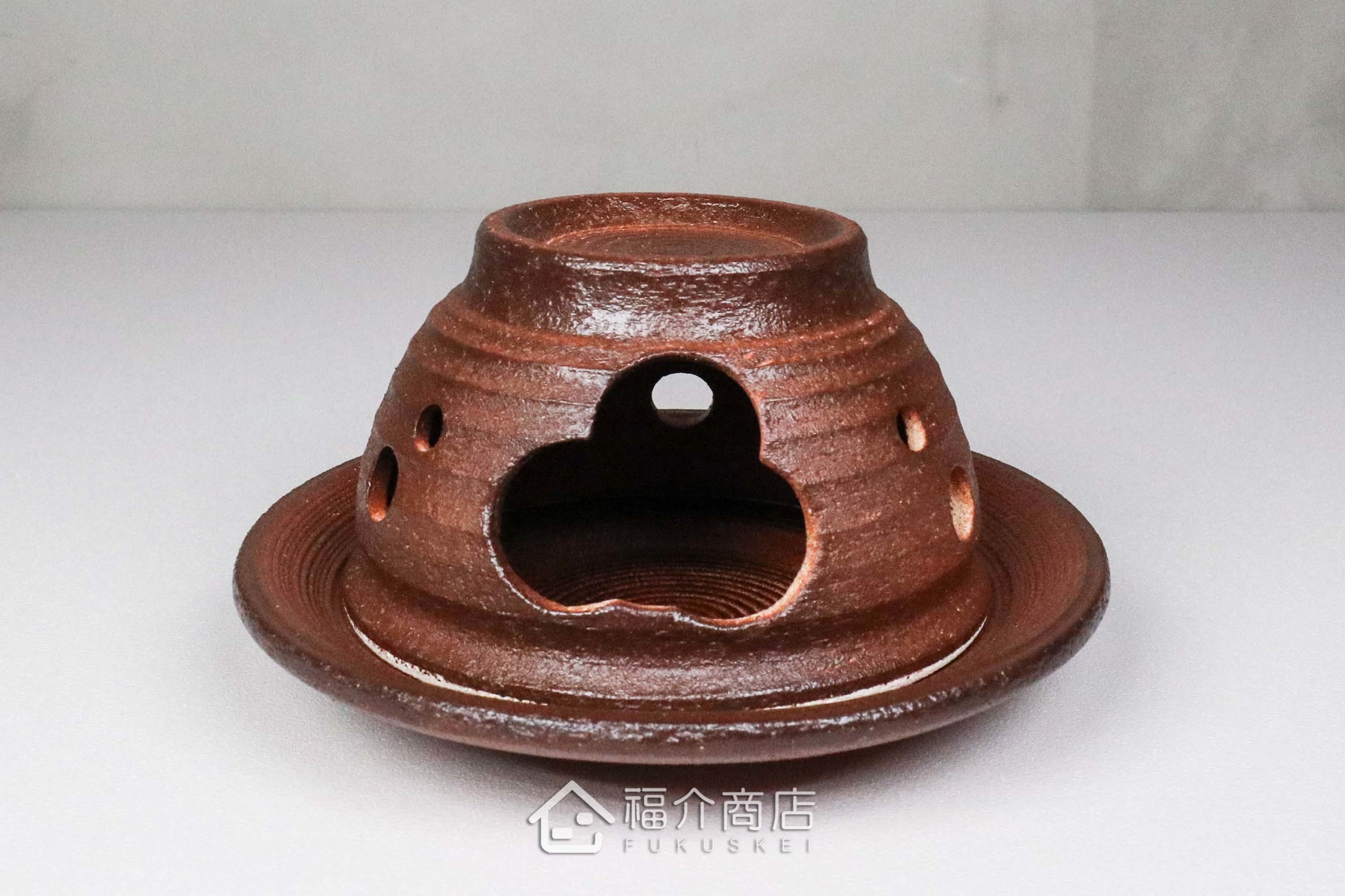 咖啡色的陶瓷茶香爐