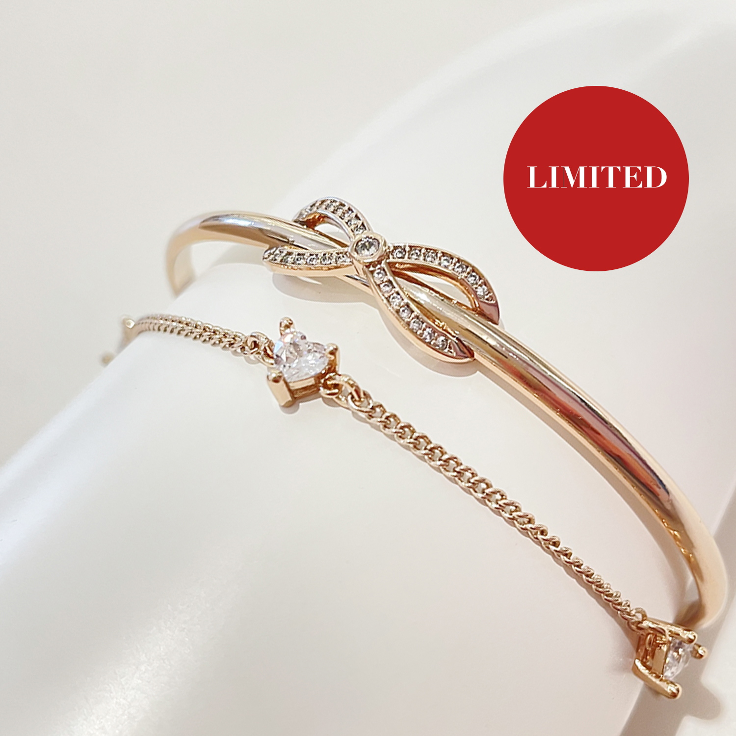 Bangle with Heart shaped Zircon stones & Bow details (Light Gold)