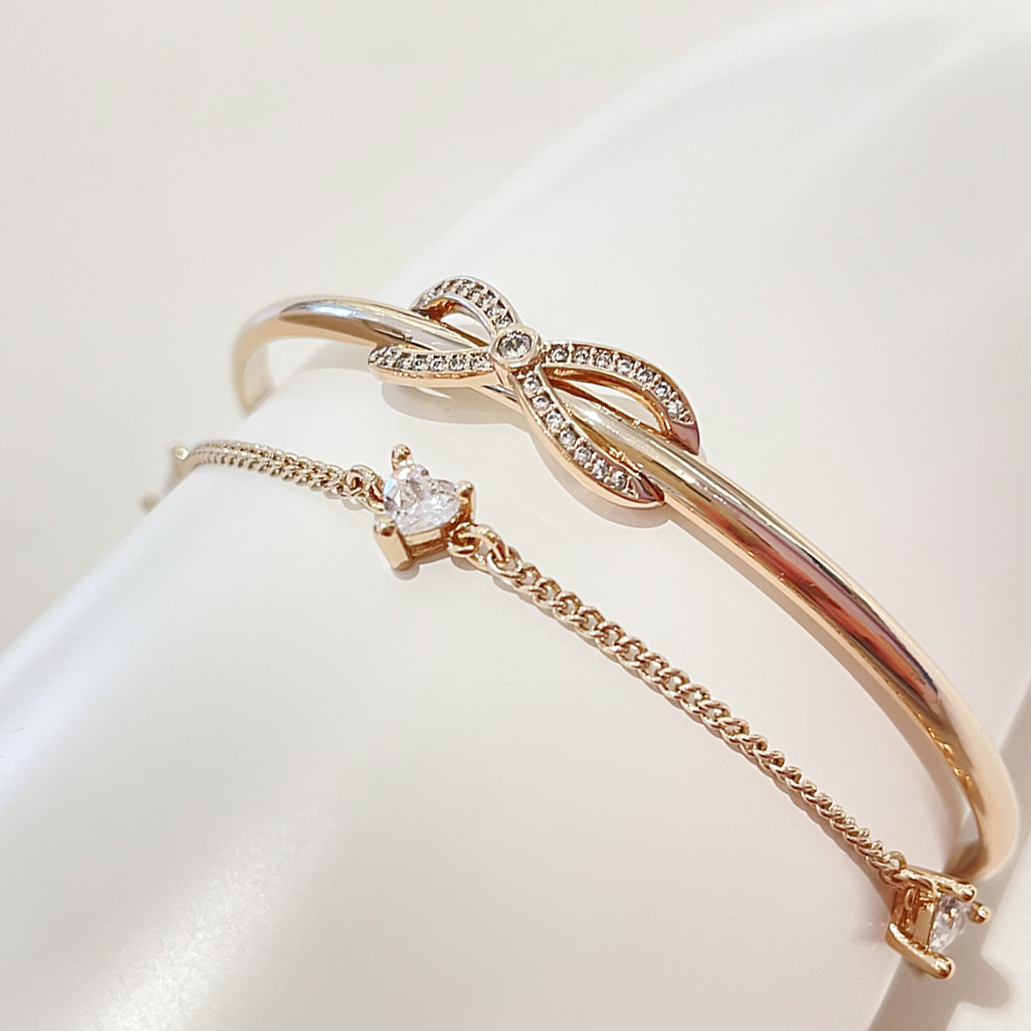 Bangle with Heart shaped Zircon stones & Bow details (Light Gold)