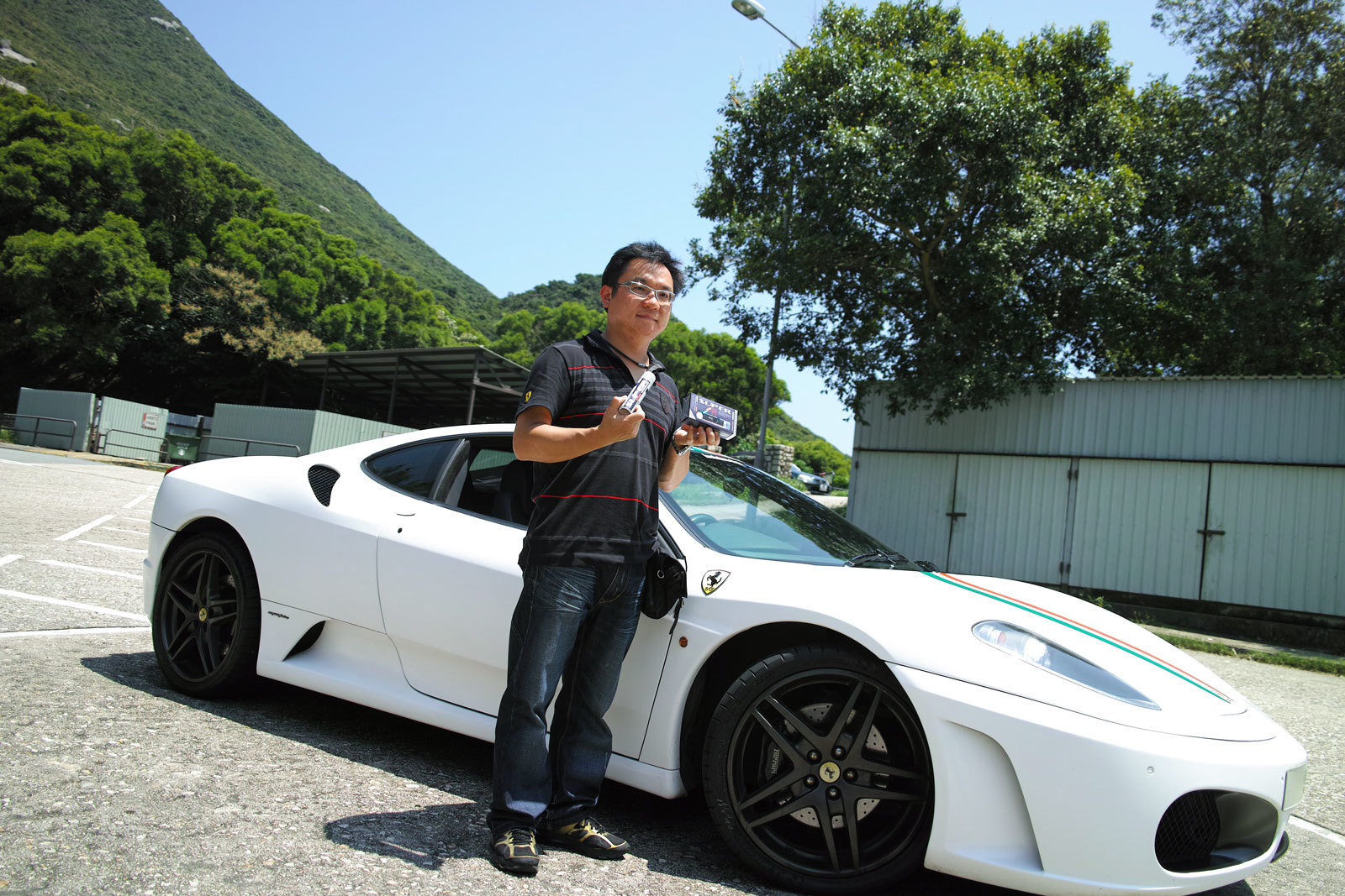 Peter wong with his Ferrari F430 white supercar