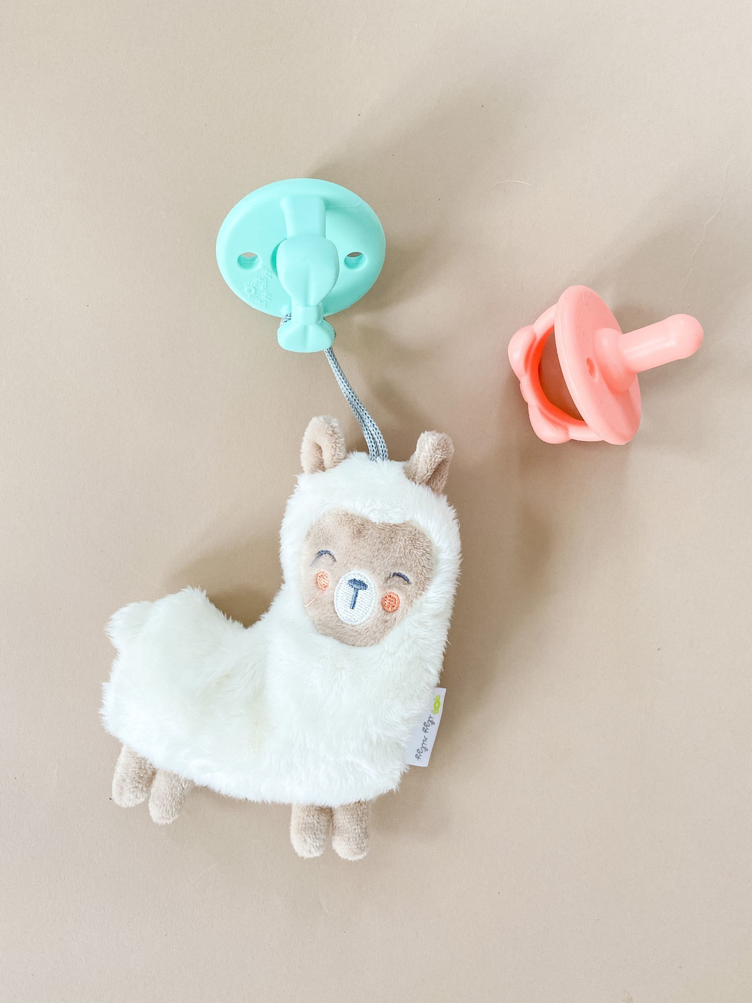 Itzy Ritzy-甜心安撫奶嘴-Aquamarine and Peach Bows