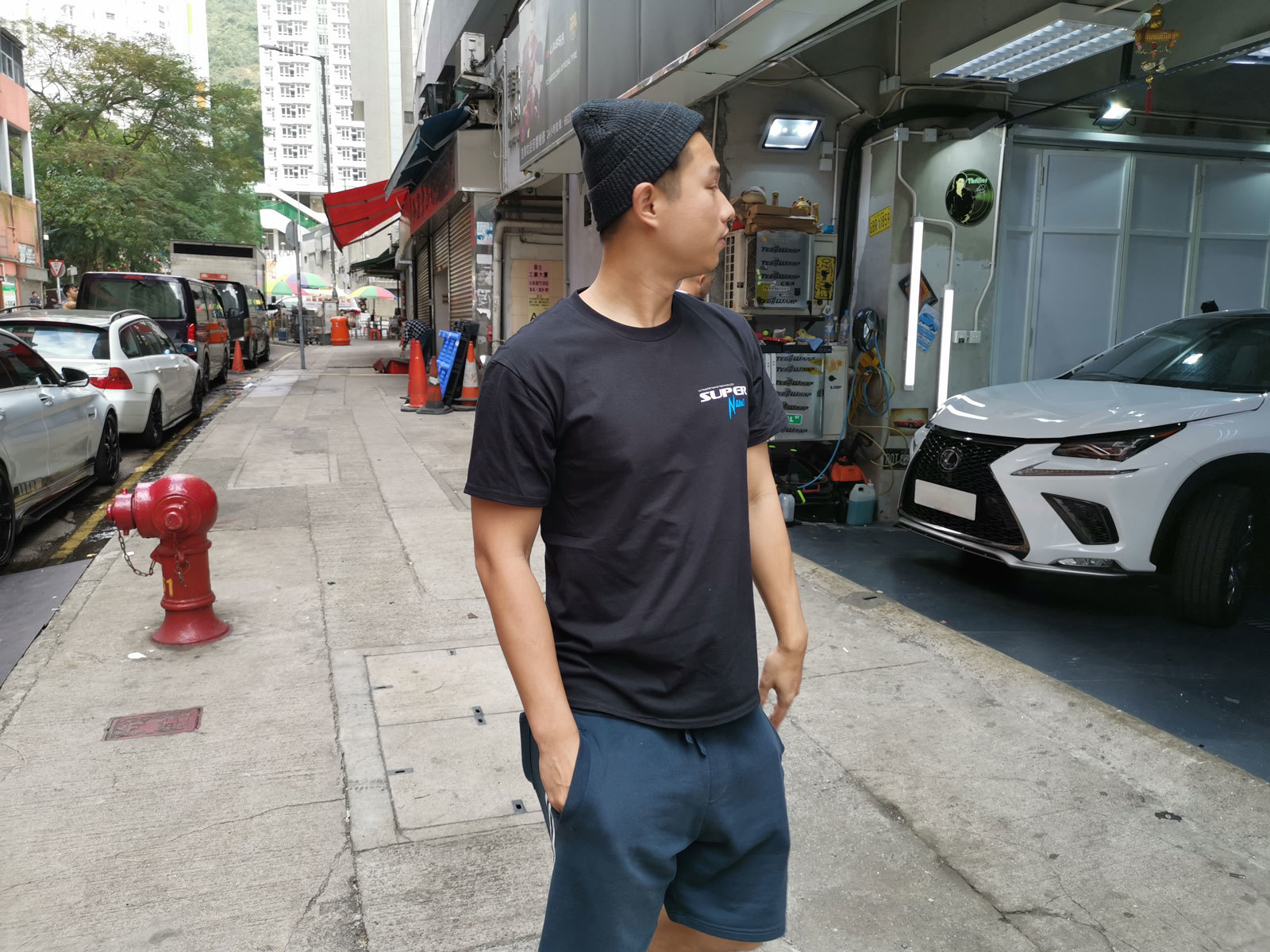 will tam looking at garage wearing super nano black t shirt