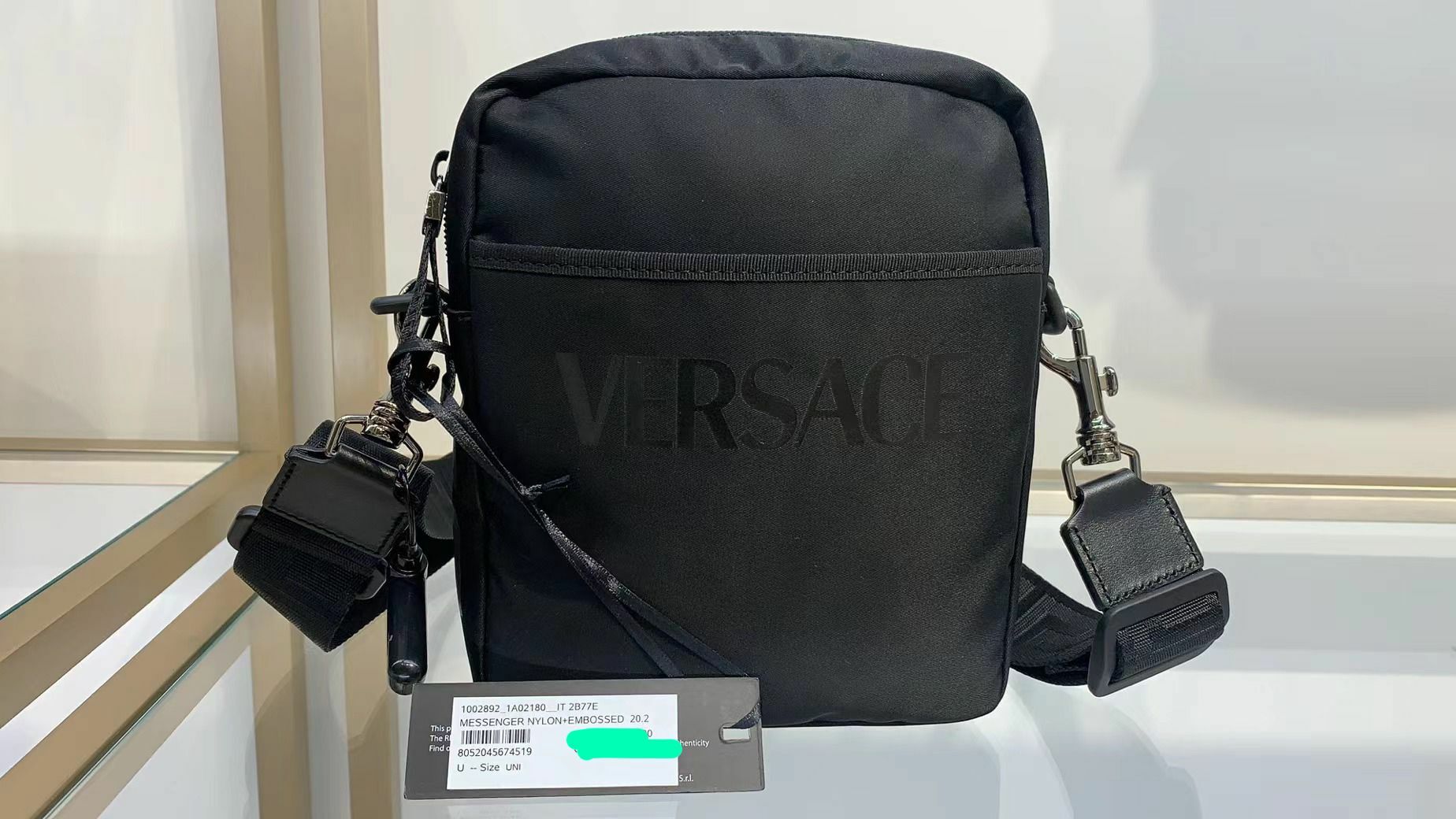 VERSACE NYLON MAN SMALL SLING BAG WITH WORDS VERSACE L