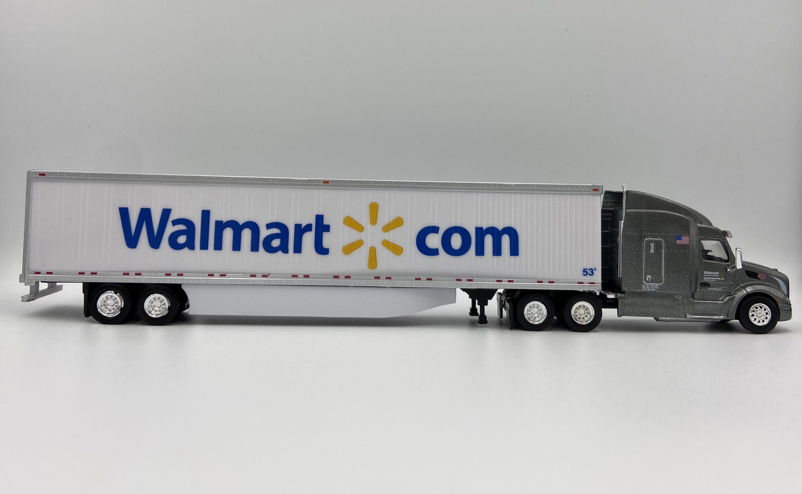 TrucksnStuff 46114 HO Scale Peterbilt 579 Sleeper Cab Tractor with 53' Dry Van Trailer - Assembled -- Walmart (Fuel Saver Special Edition; gray, white, blue, yellow; Spark Logo)