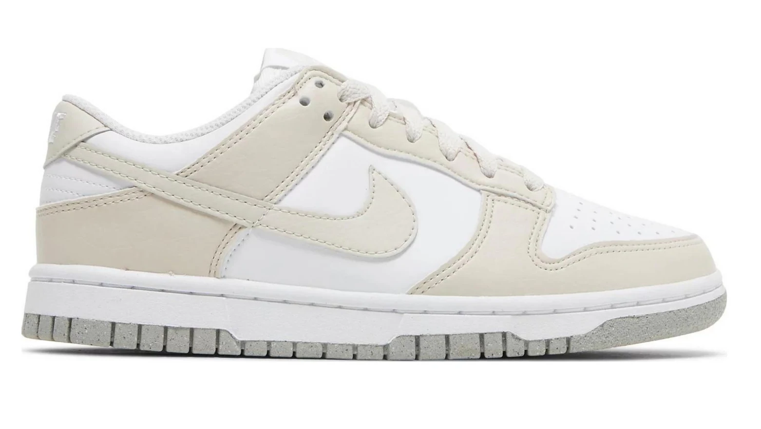 beige and white nike trainers