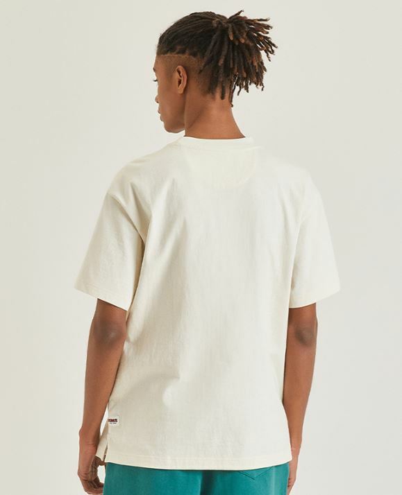 NEW BALANCE X SNOOPY 史努比 來打網球 卡通圖案 口袋短袖 奶油白 NBNEC2L013_64