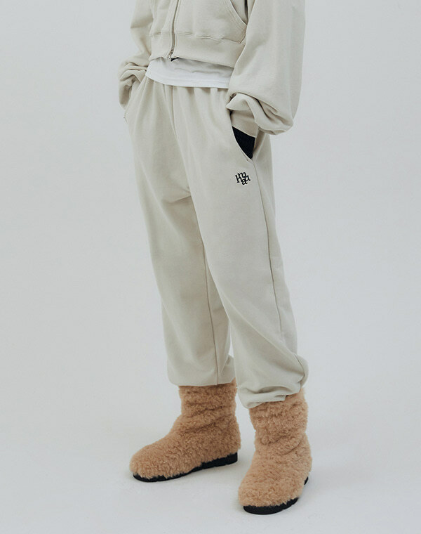 MUAH MUAH Symbol Logo Point Banding Jogger Pants