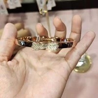 [S] KATE SPADE O0RU1567 READY SET BOW PAVE BOW BANGLE,CLR/RSEGLD, 98686624931 (SKS245)