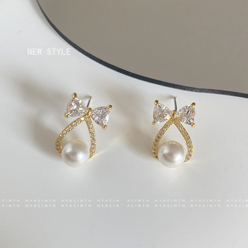 蝴蝶結綴珠耳環