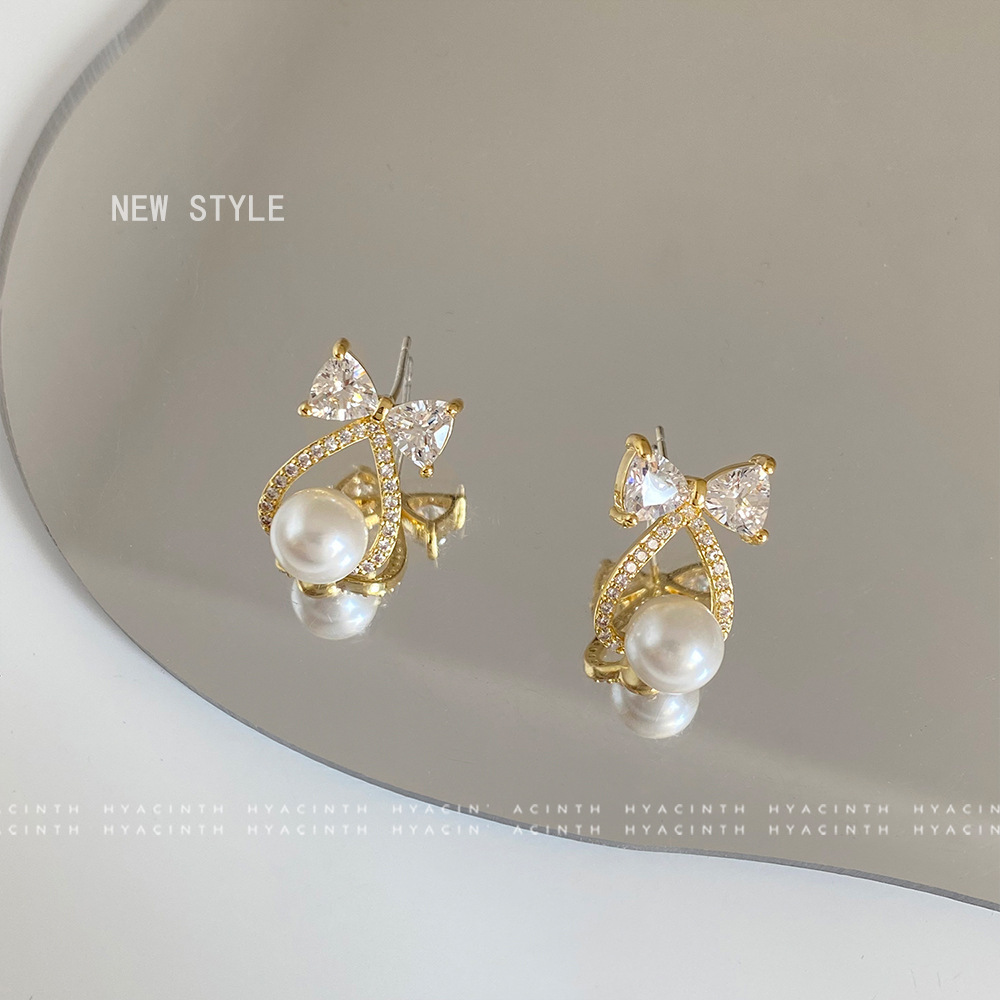 蝴蝶結綴珠耳環