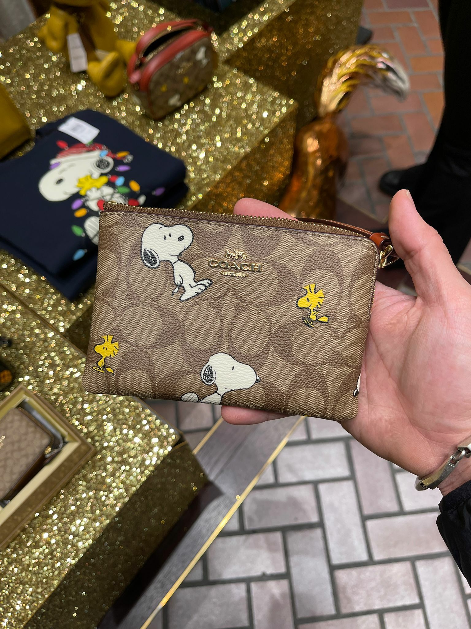 COACH LEATHER WRISTLET WITH SNOOPY