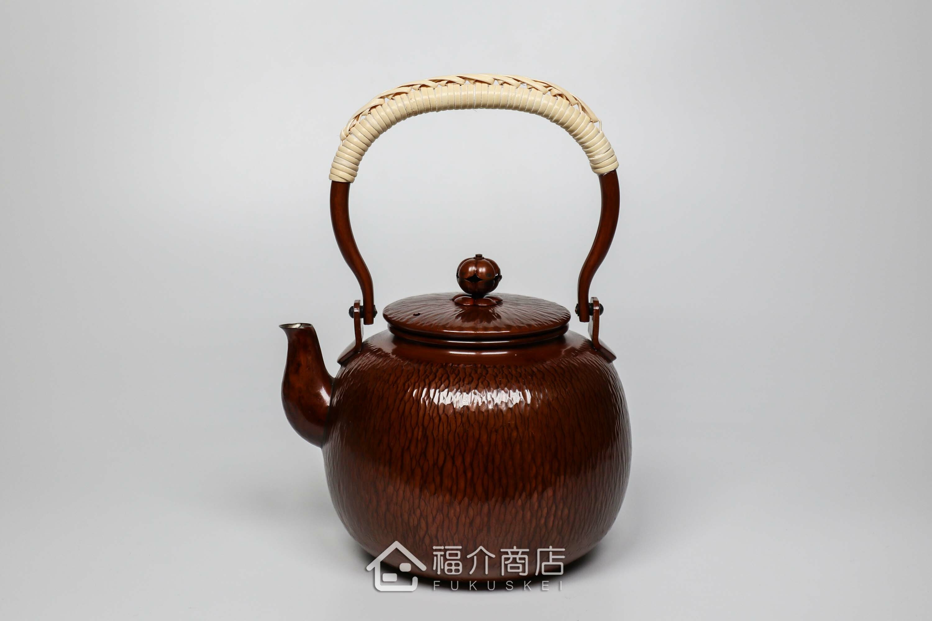 編織提把造型的咖啡色石目紋銅壺