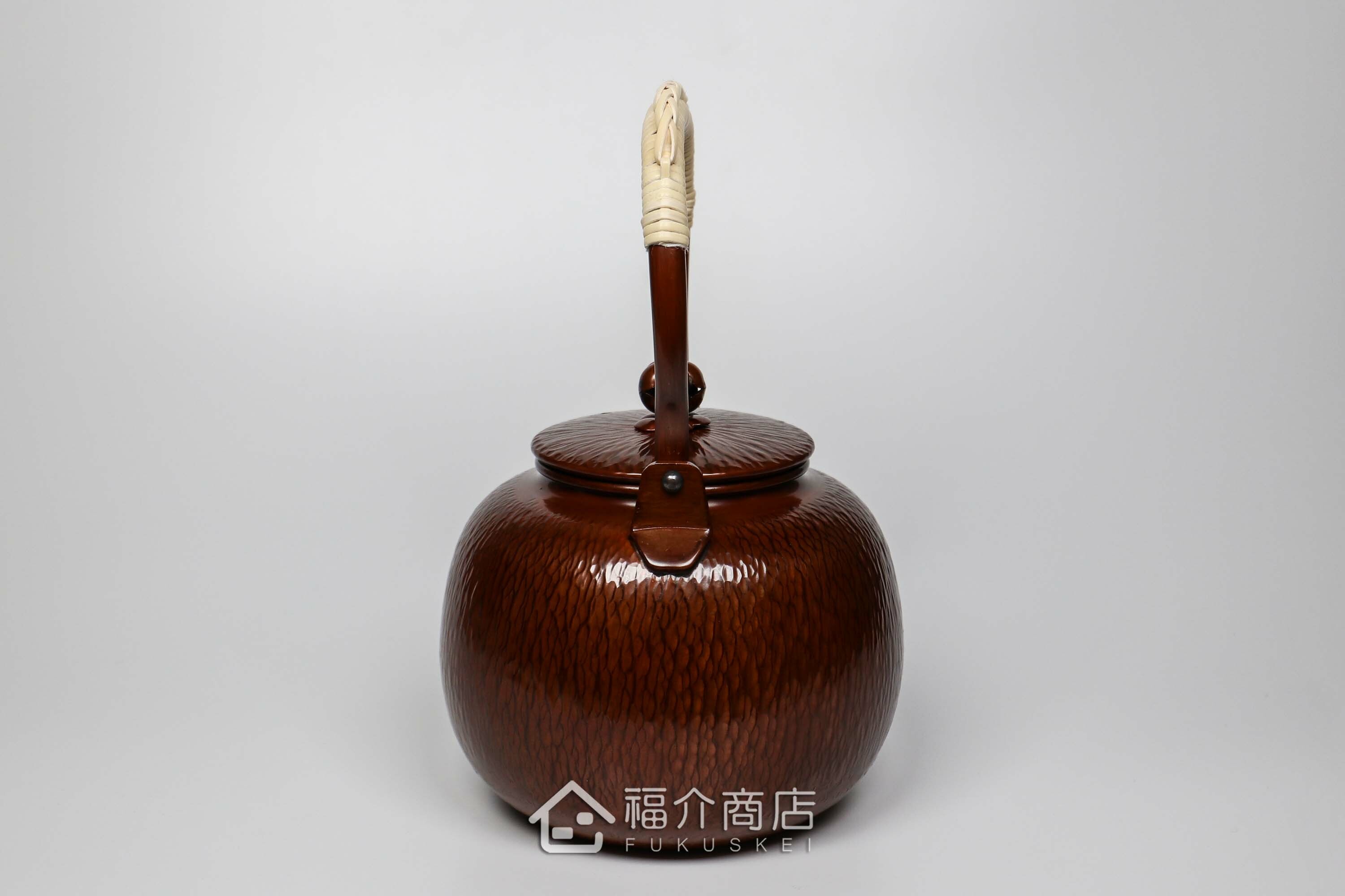 編織提把造型的咖啡色石目紋銅壺