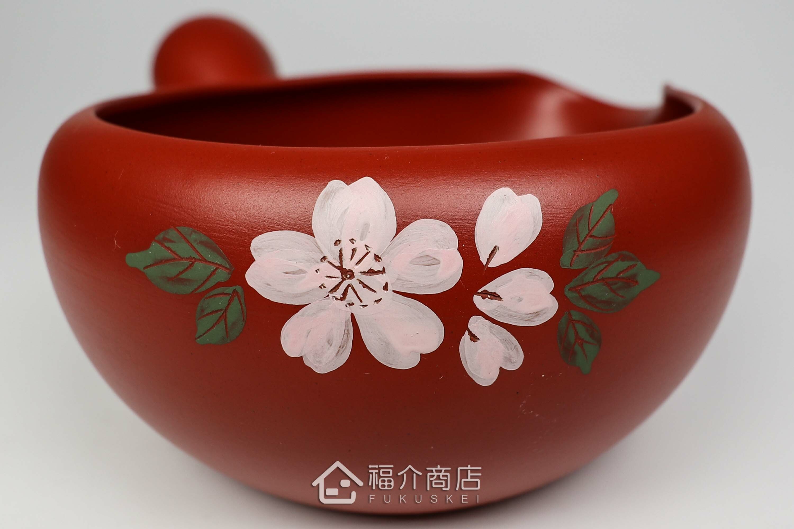 泡茶時將茶水分別倒入杯子的分茶壺