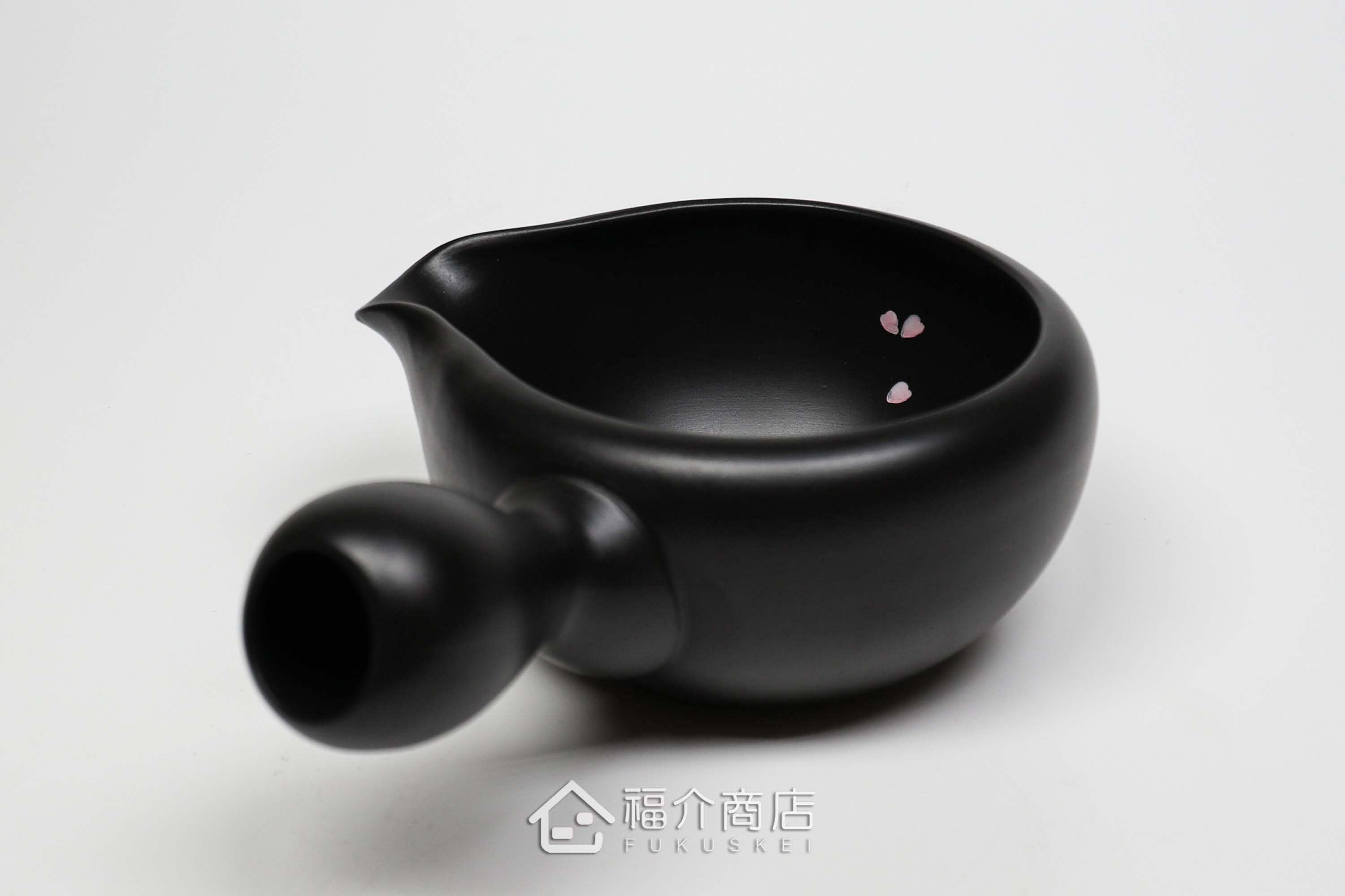 泡茶時將茶水分別倒入杯子的分茶壺