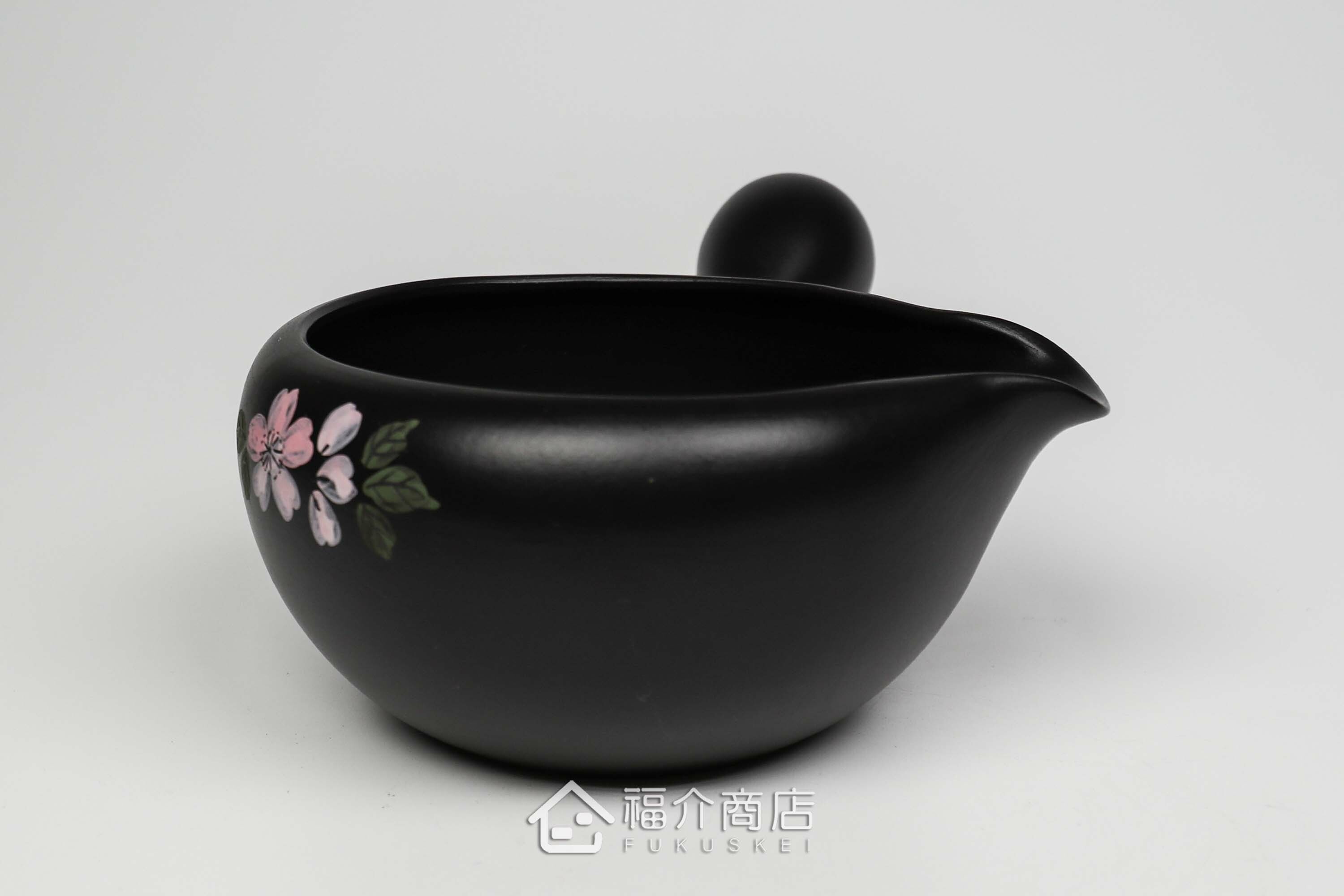 泡茶時將茶水分別倒入杯子的分茶壺