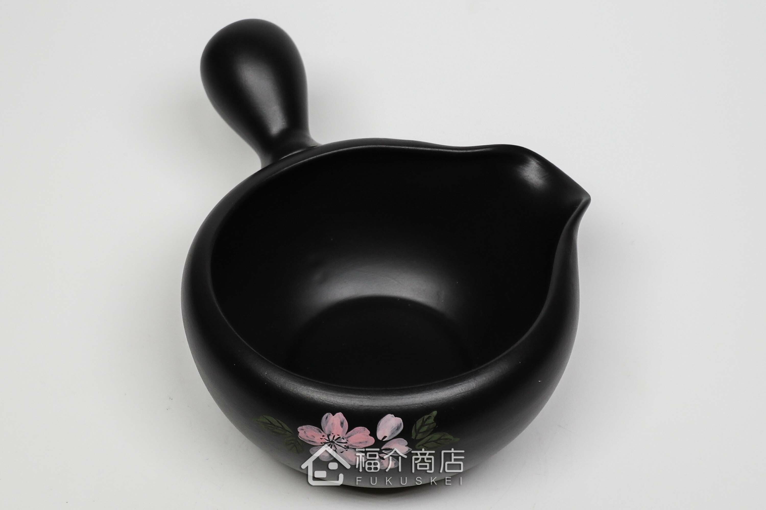 泡茶時將茶水分別倒入杯子的分茶壺