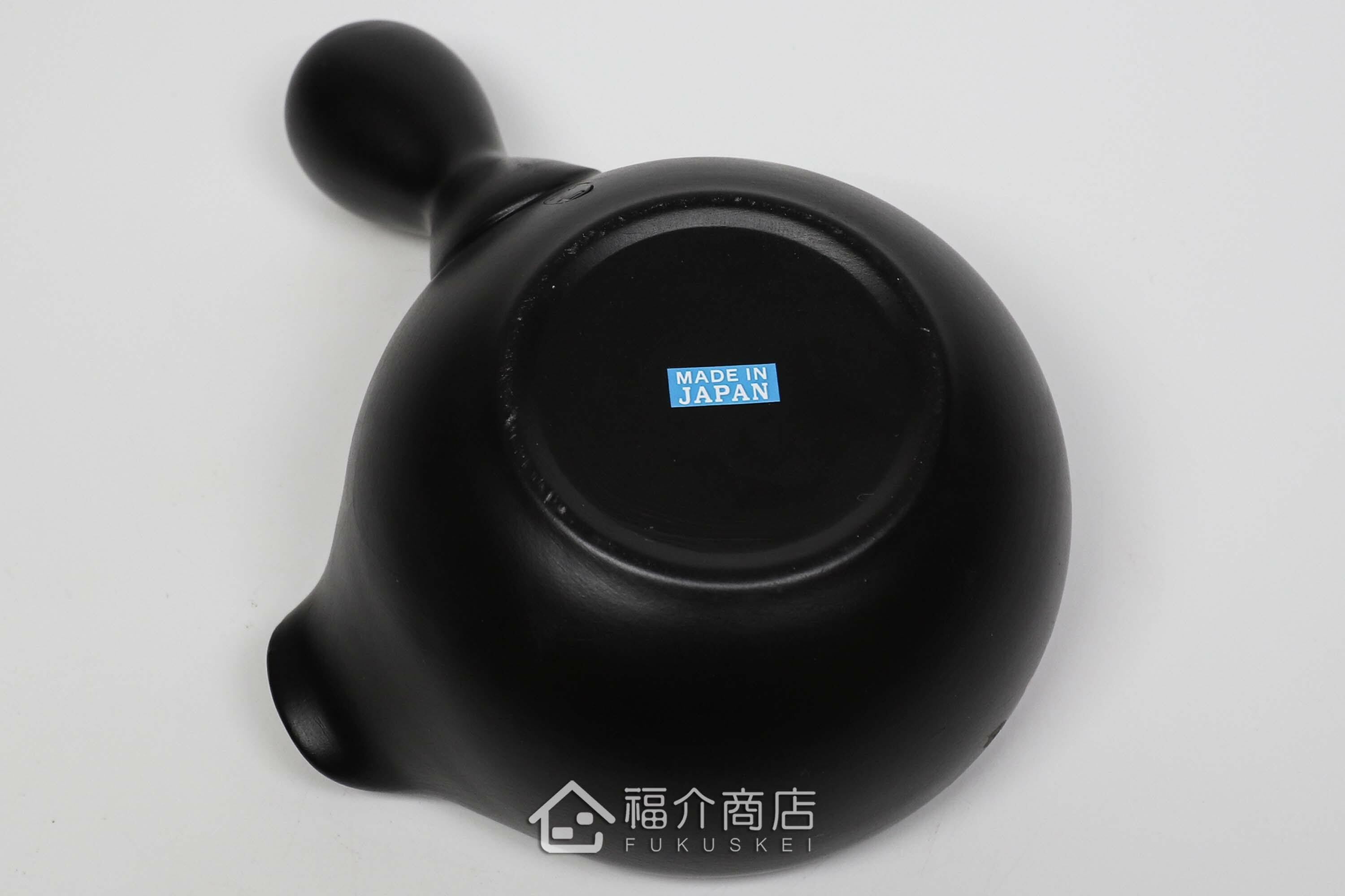 泡茶時將茶水分別倒入杯子的分茶壺