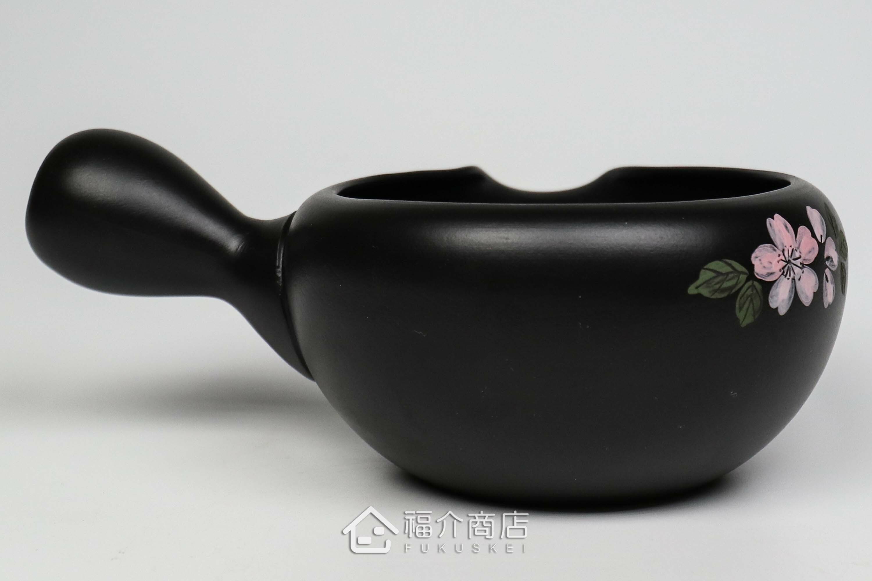 泡茶時將茶水分別倒入杯子的分茶壺