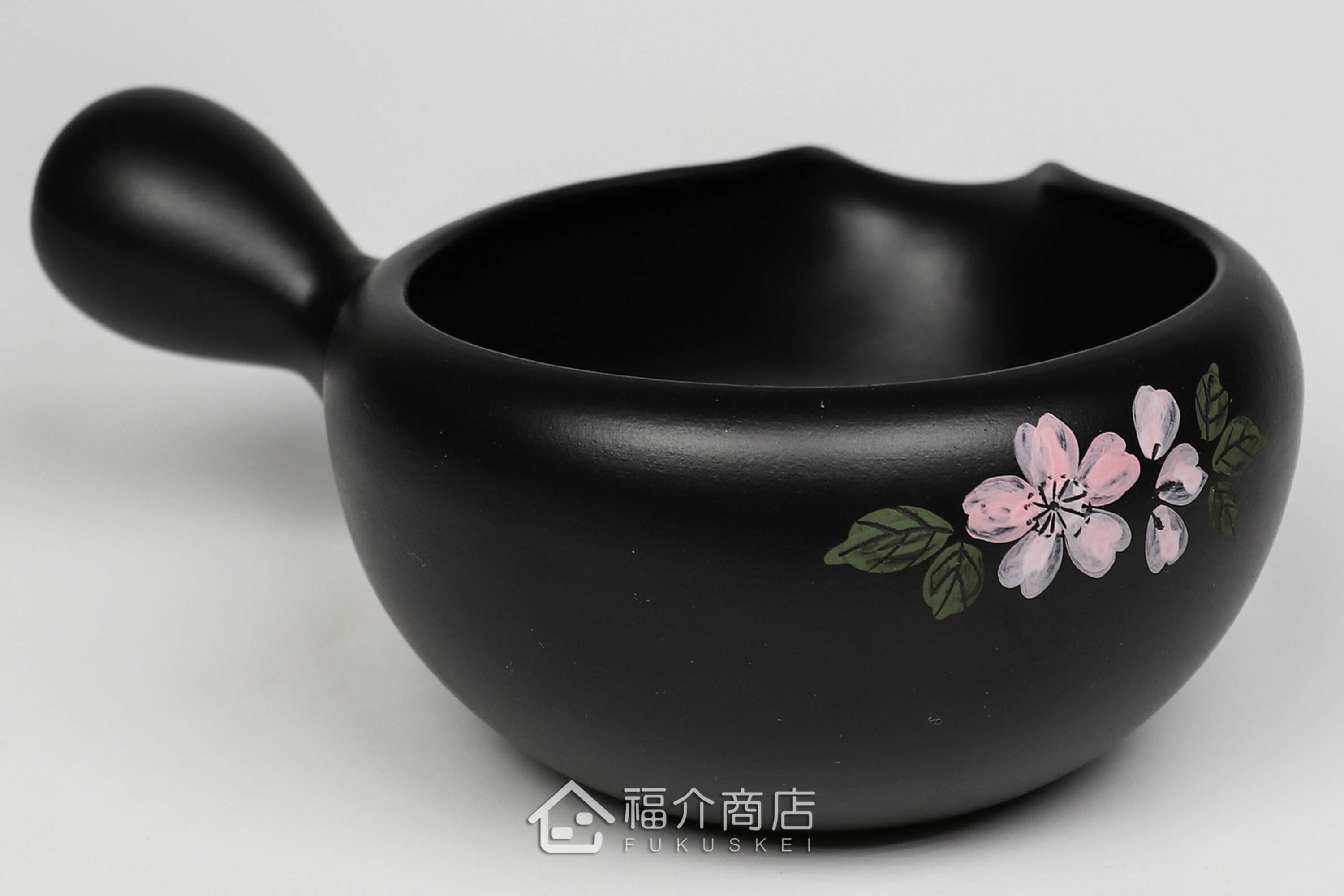 泡茶時將茶水分別倒入杯子的分茶壺