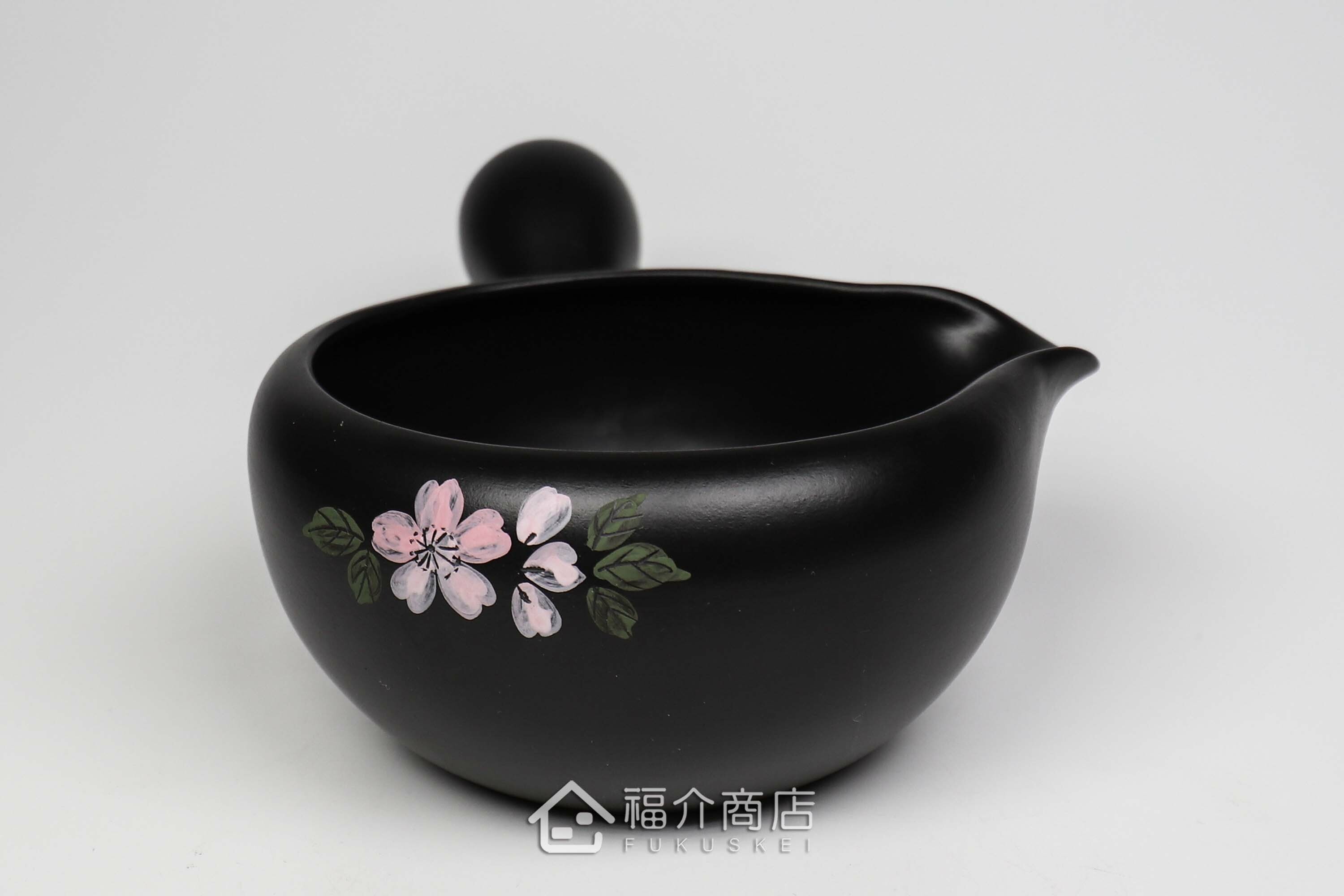 泡茶時將茶水分別倒入杯子的分茶壺