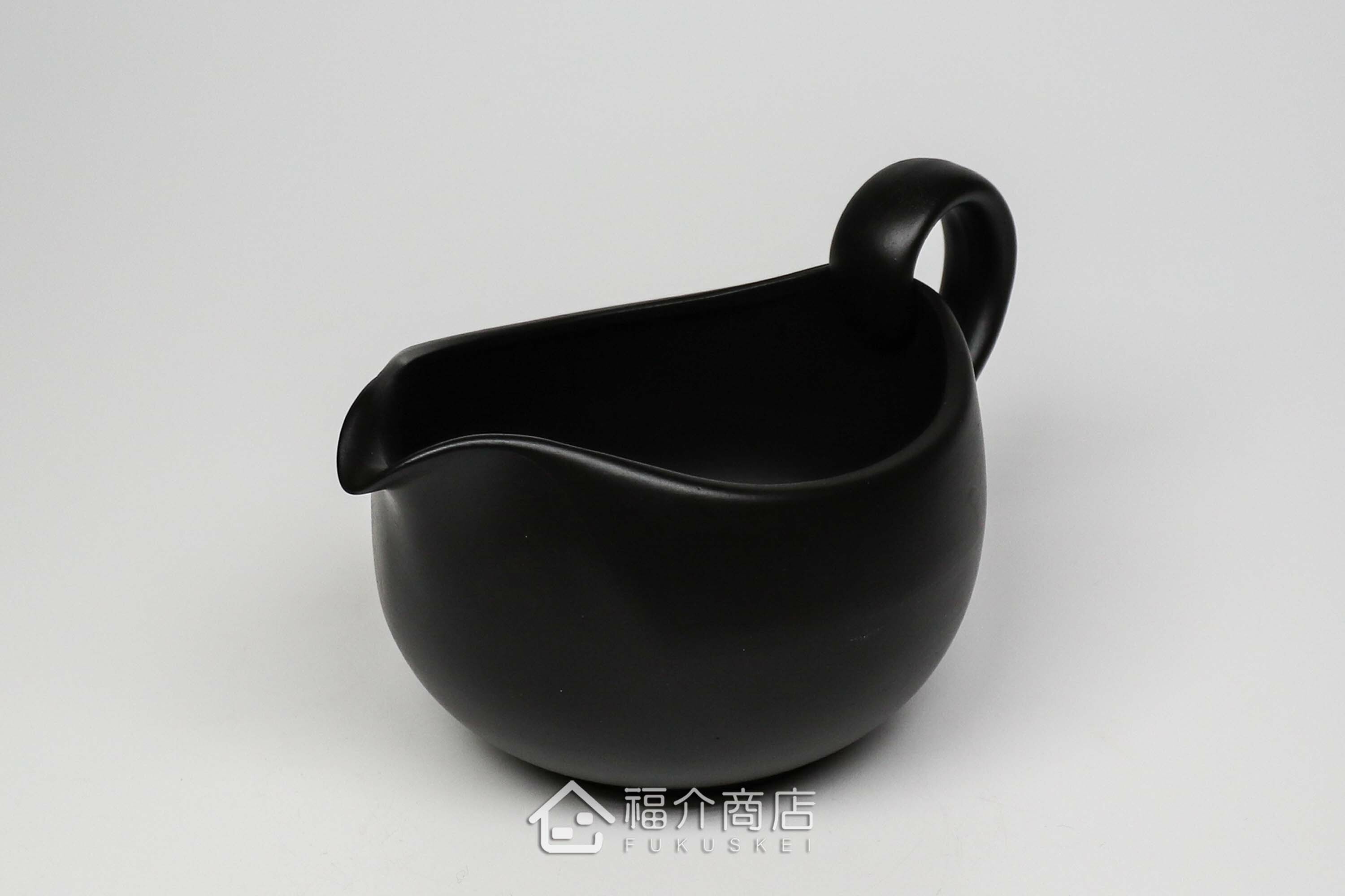 泡茶時將茶水分別倒入杯子的分茶壺