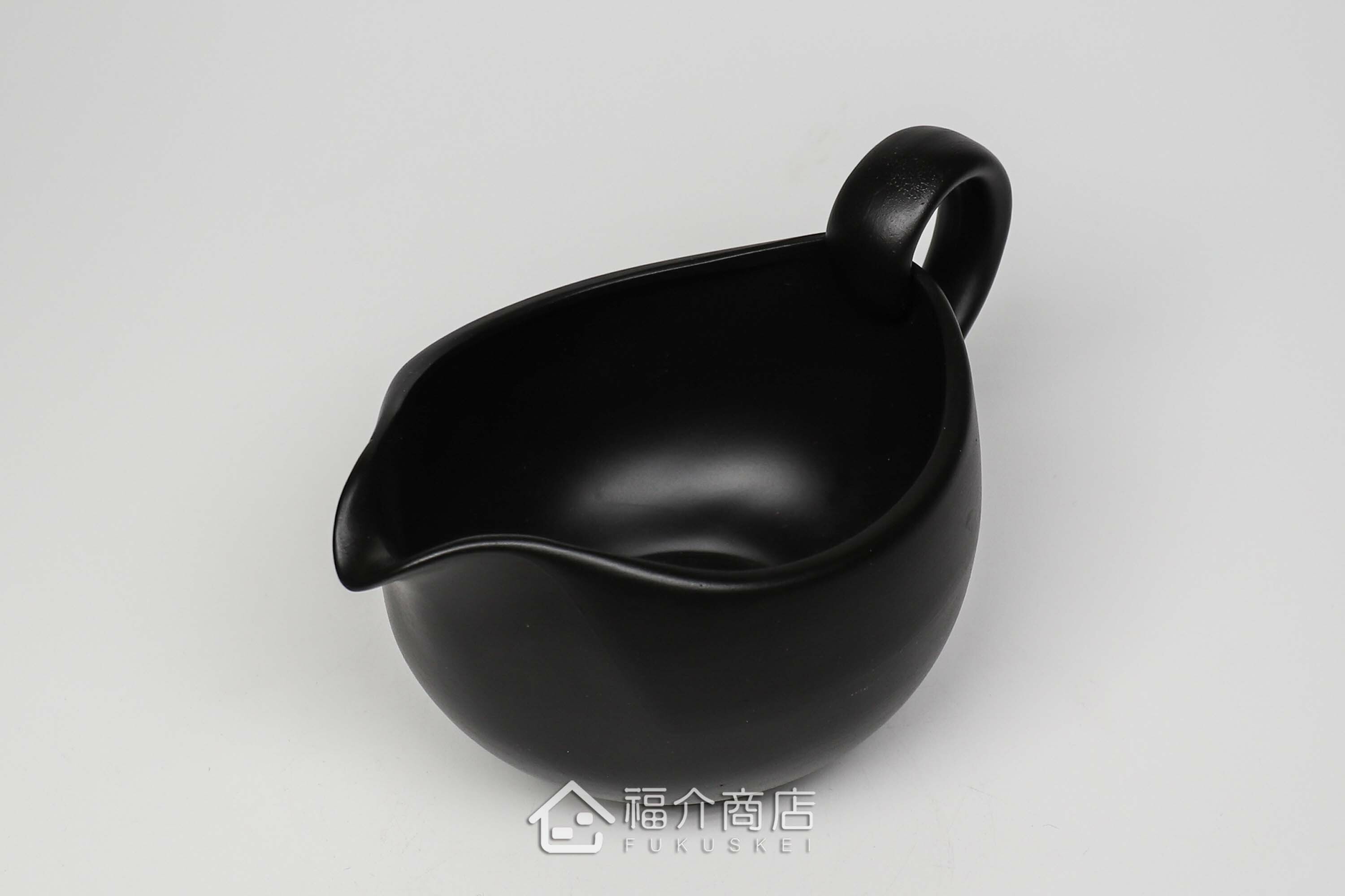 泡茶時將茶水分別倒入杯子的分茶壺