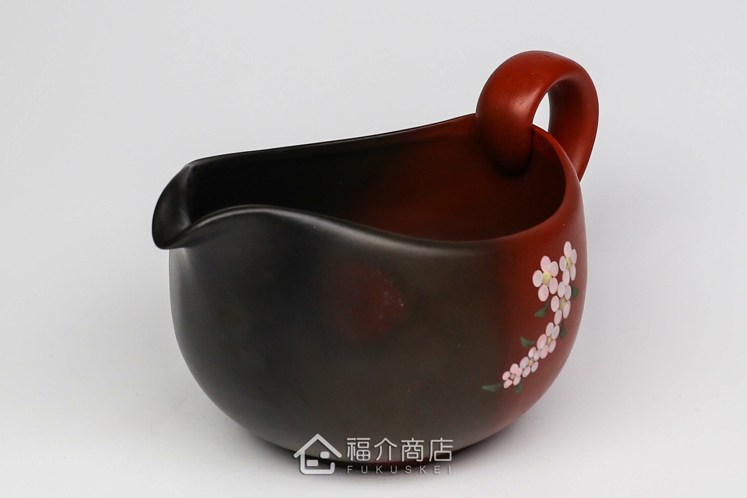 泡茶時將茶水分別倒入杯子的分茶壺