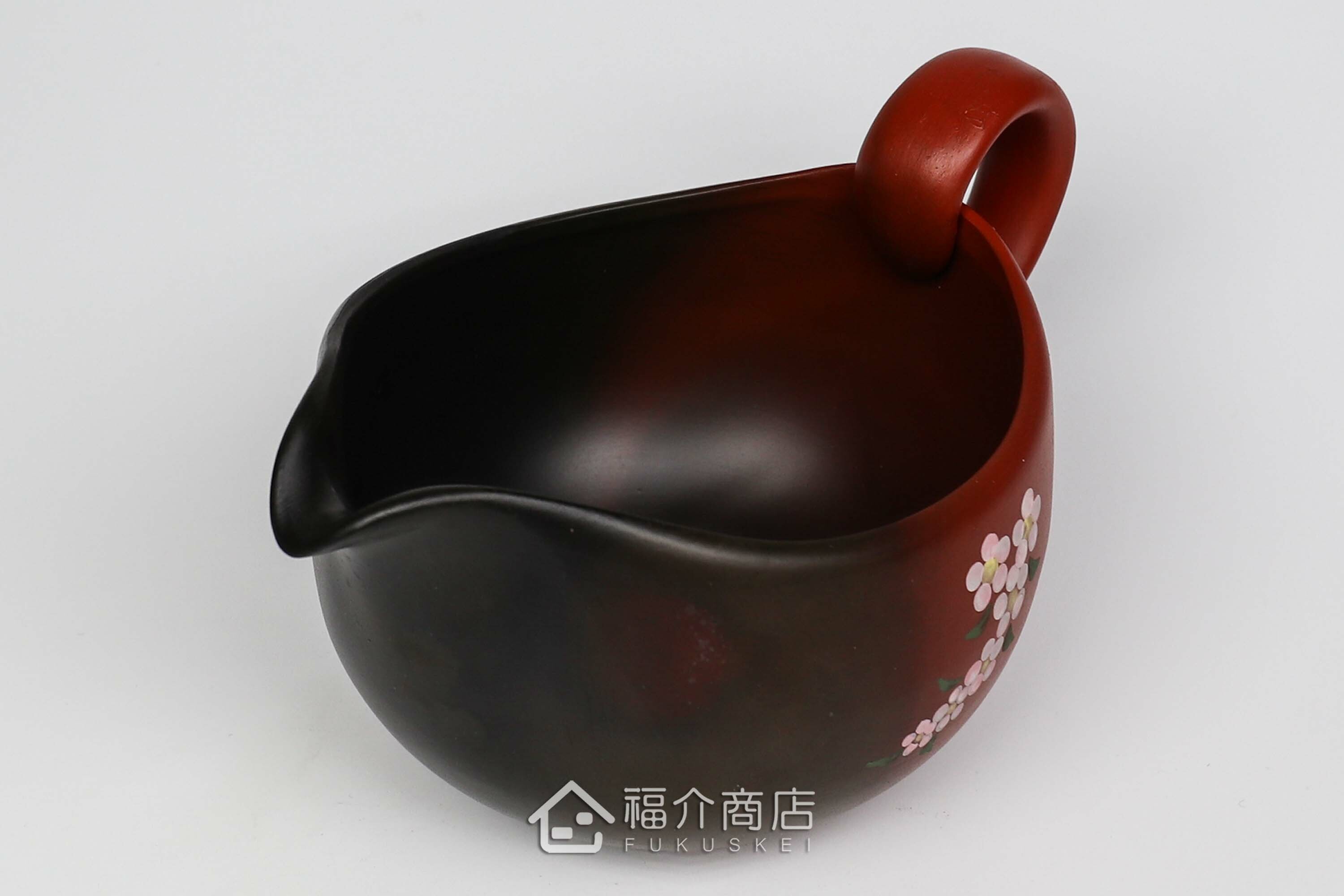 泡茶時將茶水分別倒入杯子的分茶壺