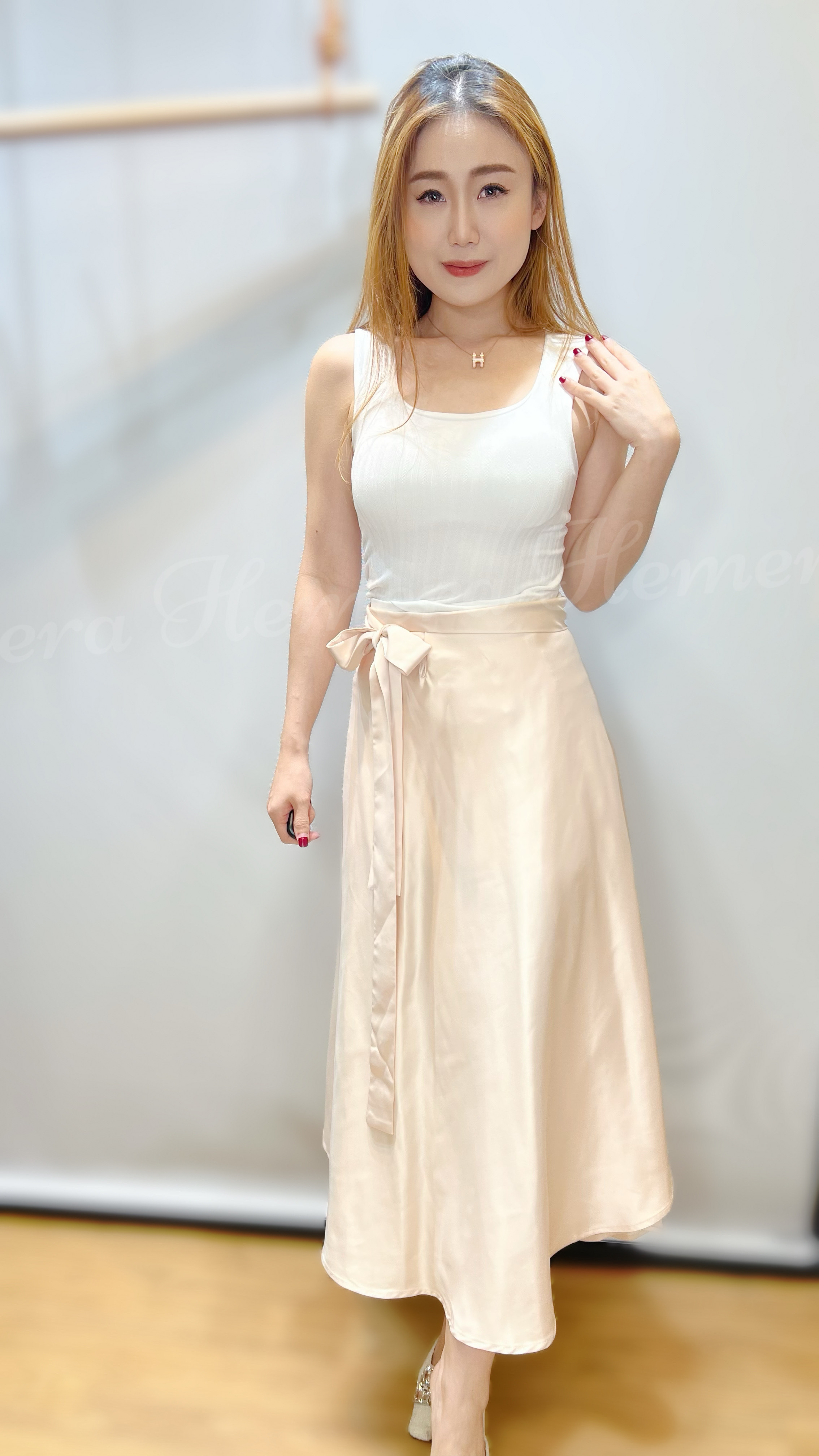 SK23W0330 滑身不規則裙擺綁帶中長裙