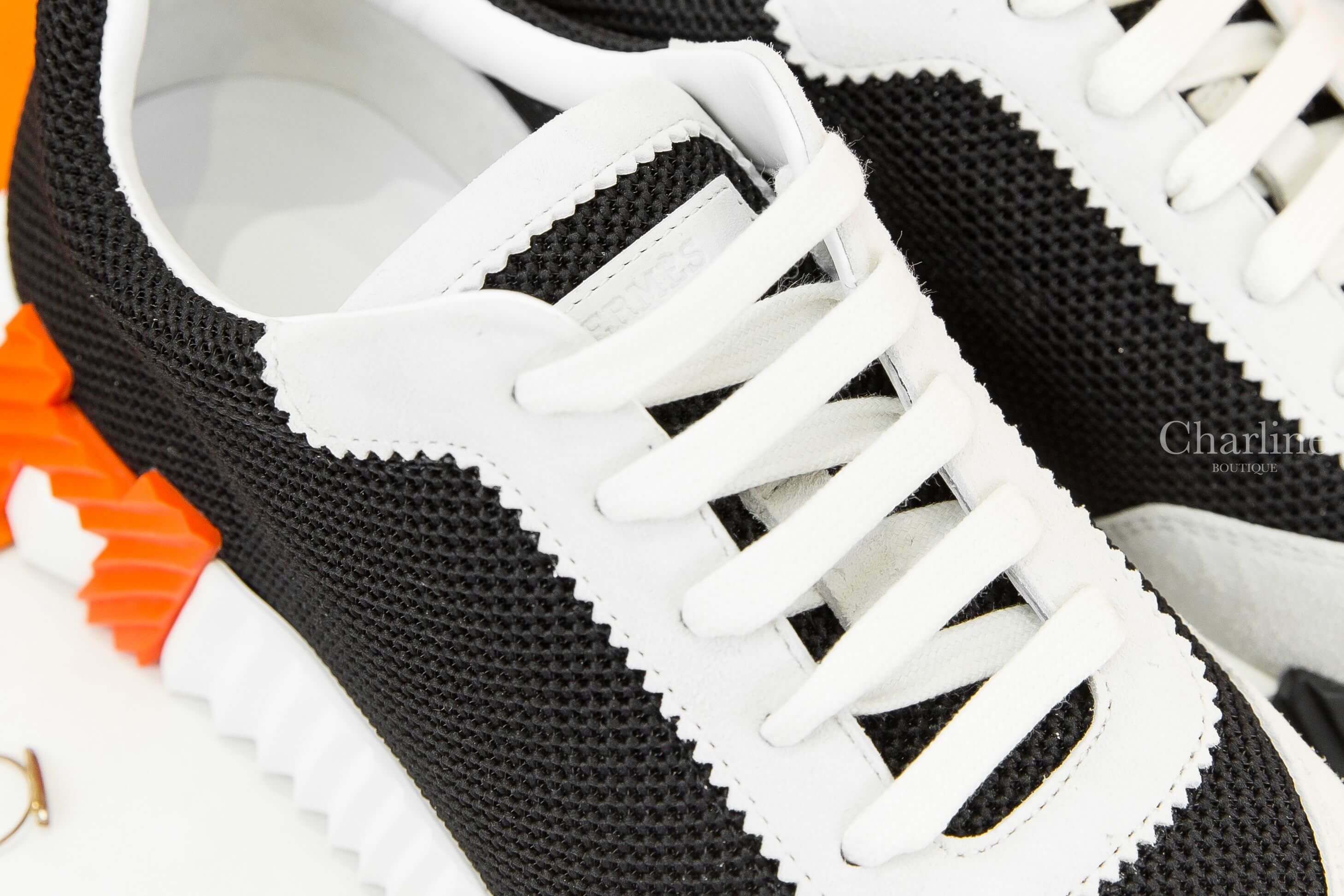 Hermès Bouncing Sneaker 黑色透氣網布白色山羊麂皮黑/橘H運動鞋