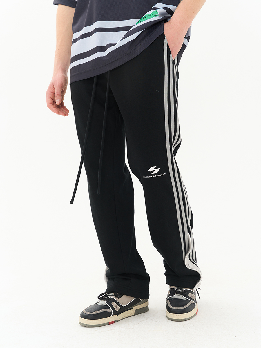 HARSH AND CRUEL 23SS 拼接條紋抽繩飛邊排扣設計運動褲 HN231060069