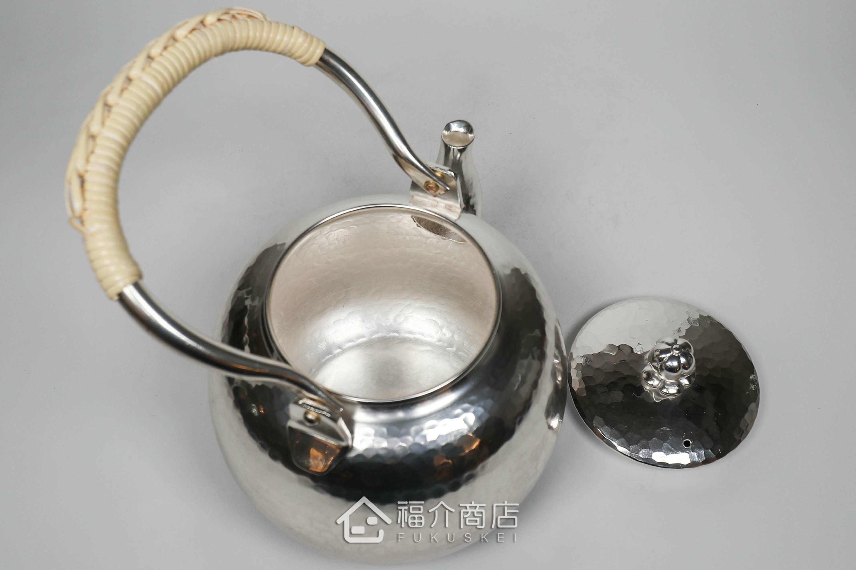 編織提樑造型的銅鍍銀壺