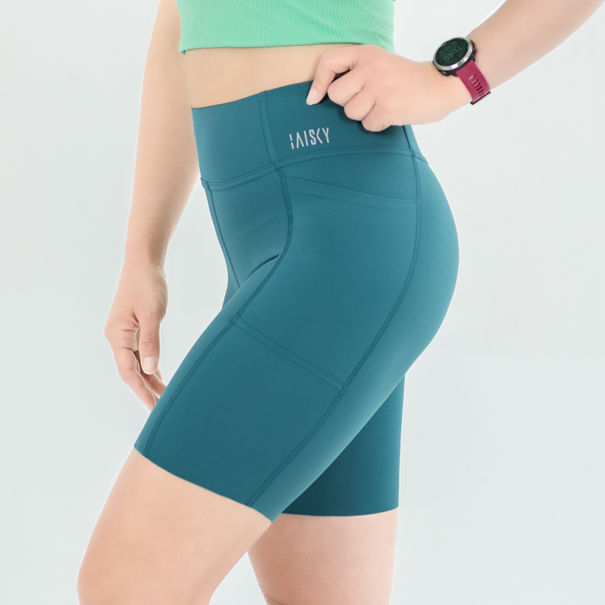 女款彈力健身五分短褲 孔雀藍