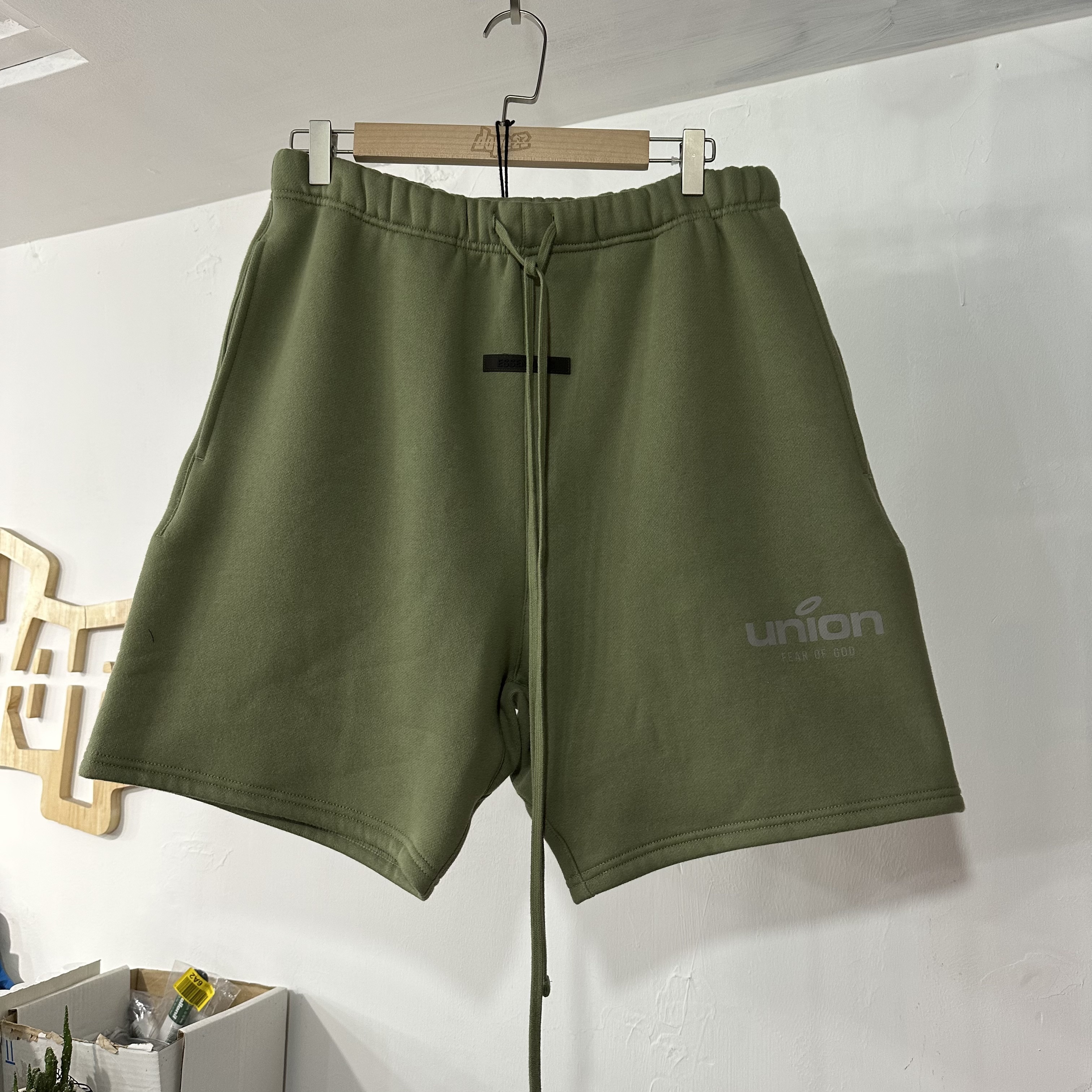 Fear of God Essentials X uinon shorts green