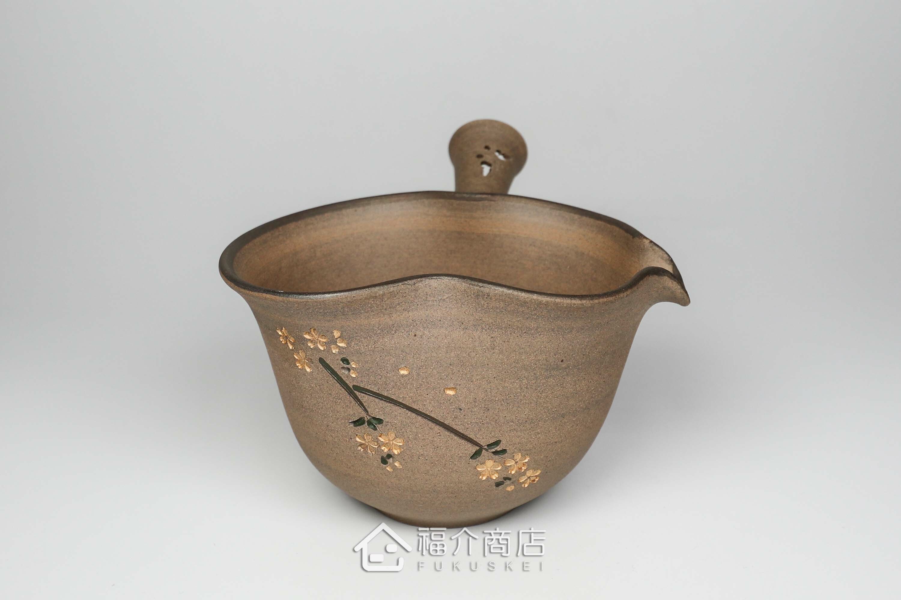 泡茶時將茶水分別倒入杯子的分茶壺