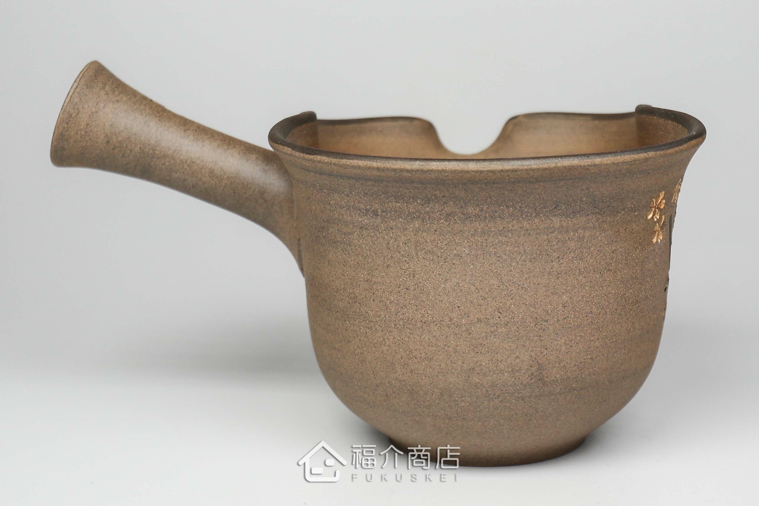 泡茶時將茶水分別倒入杯子的分茶壺