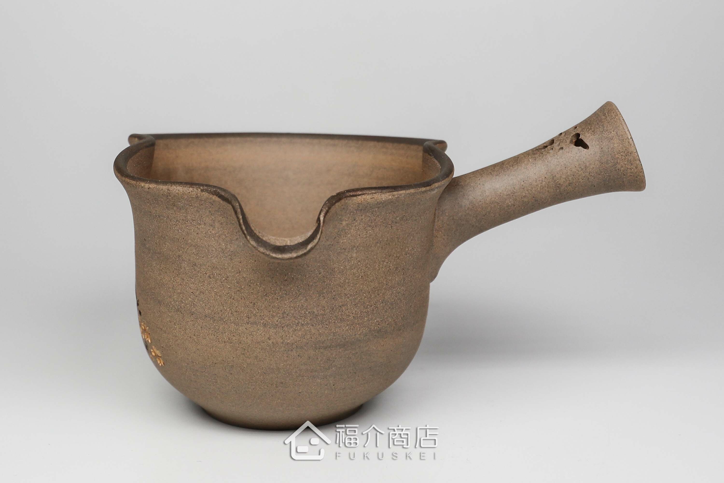 泡茶時將茶水分別倒入杯子的分茶壺