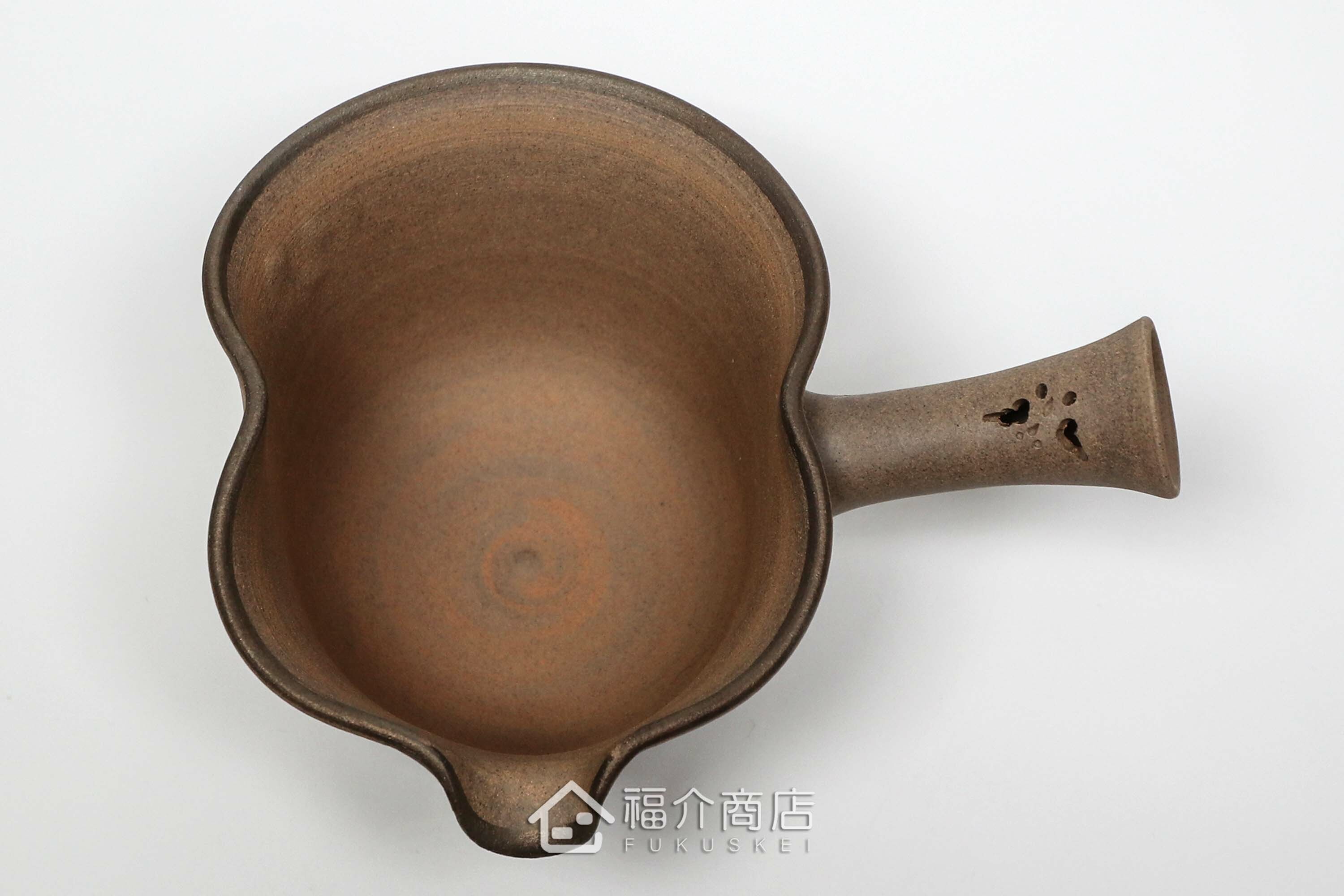 泡茶時將茶水分別倒入杯子的分茶壺