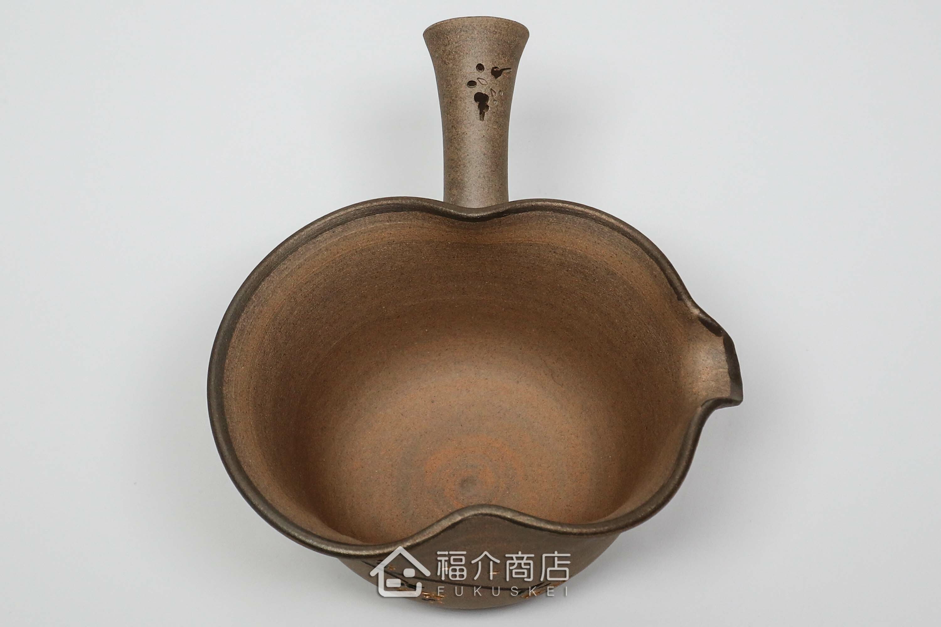 泡茶時將茶水分別倒入杯子的分茶壺