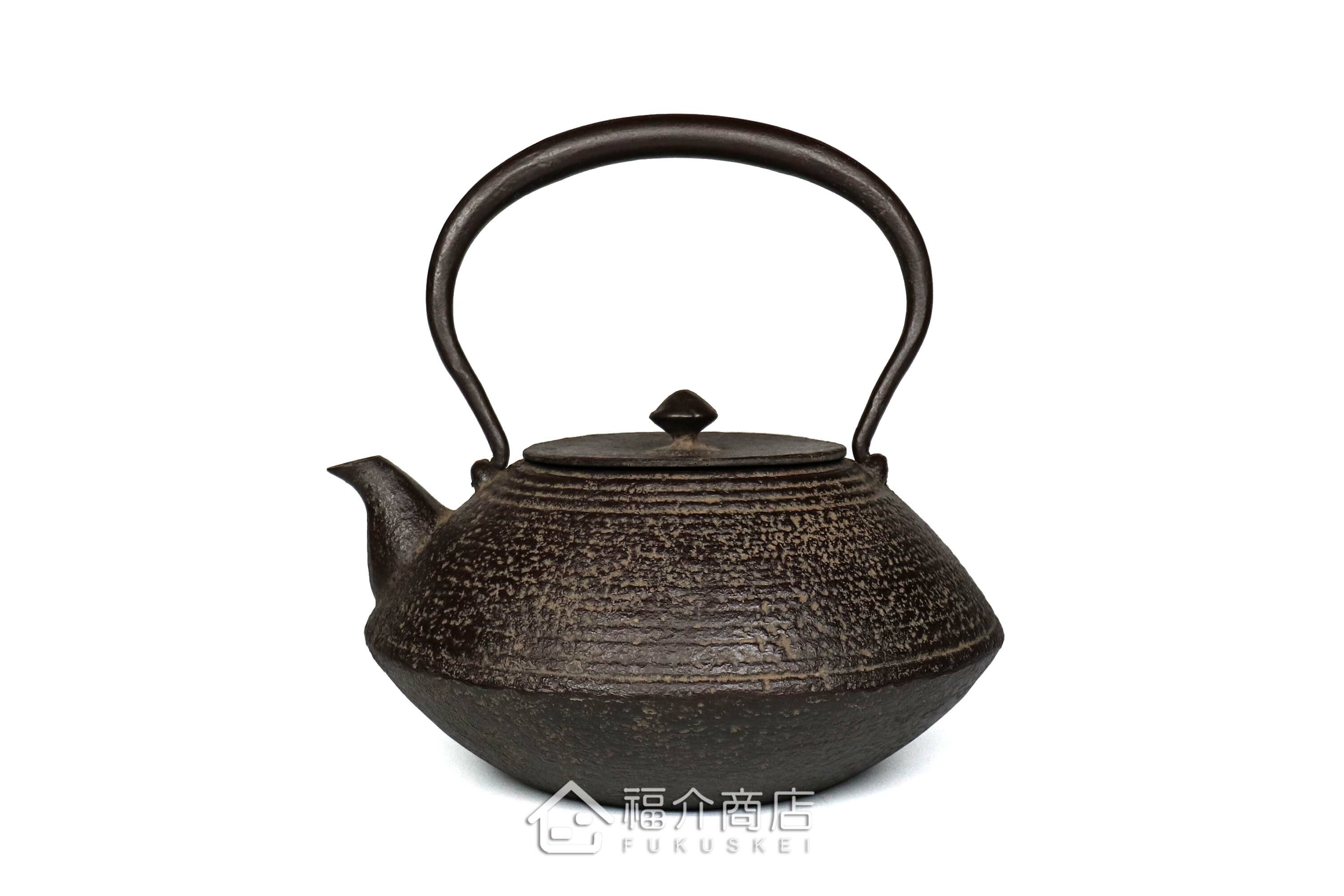 煮水泡茶用的鐵壺，壺身設計成石庭紋